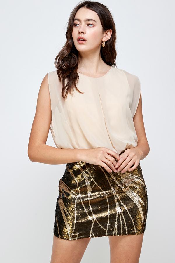 A glamorous sequin skirt paired with a sleeveless blouson top, perfect for parties.