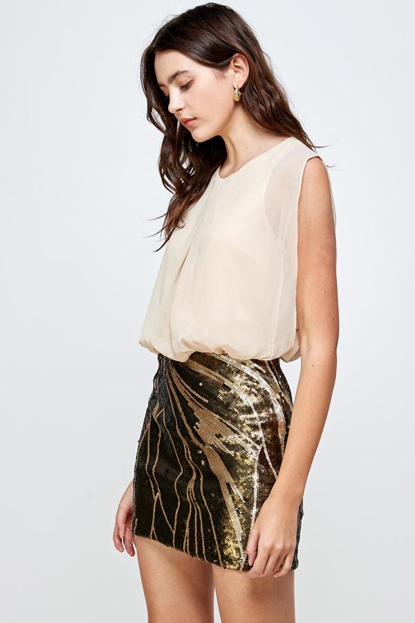 A glamorous sequin skirt paired with a sleeveless blouson top, perfect for parties.