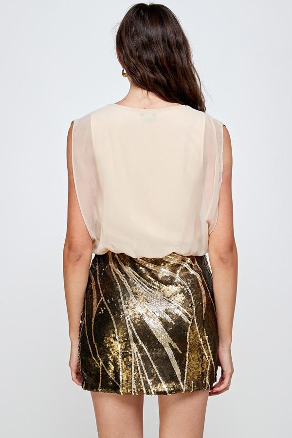A glamorous sequin skirt paired with a sleeveless blouson top, perfect for parties.