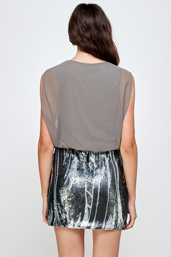 A glamorous sequin skirt paired with a sleeveless blouson top, perfect for parties.
