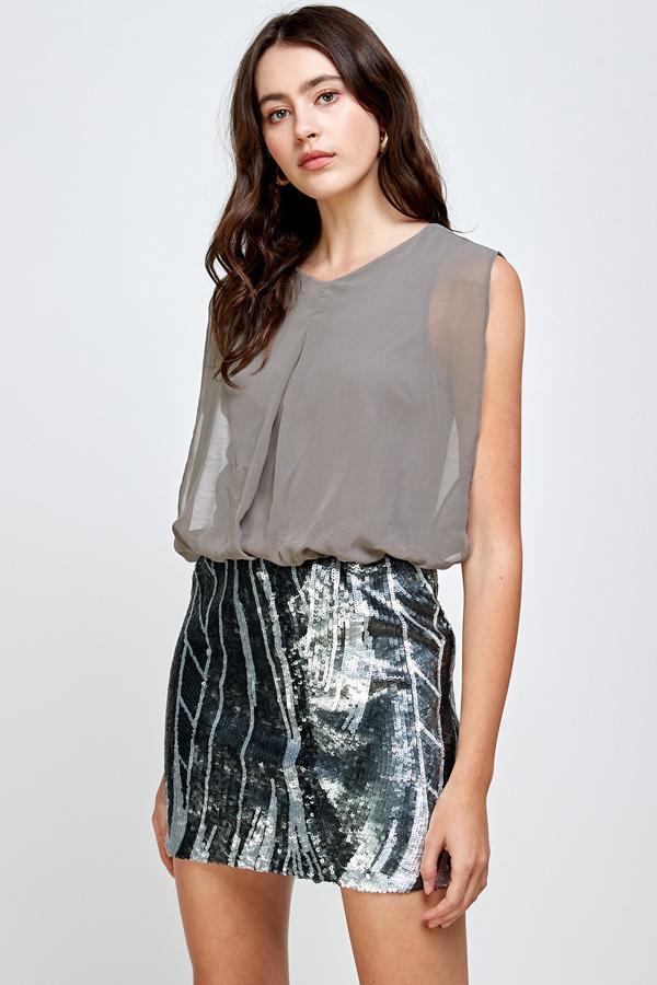 A glamorous sequin skirt paired with a sleeveless blouson top, perfect for parties.