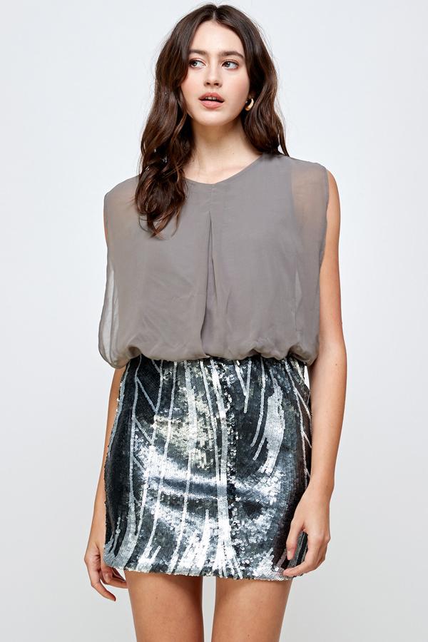 A glamorous sequin skirt paired with a sleeveless blouson top, perfect for parties.