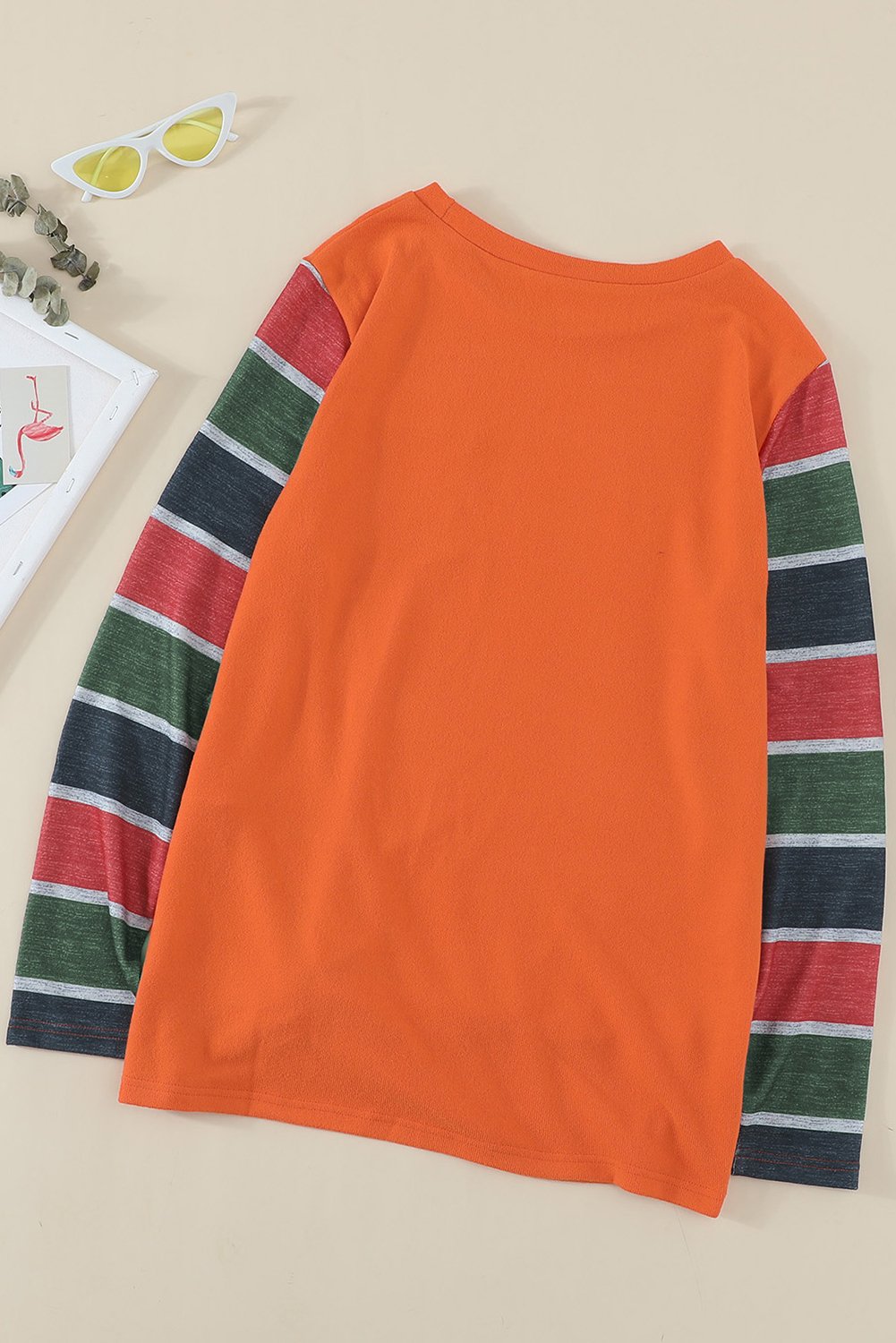Sequin Splicing Colorful Stripes Long Sleeve Top featuring vibrant stripes and a stylish sequin pocket detail.