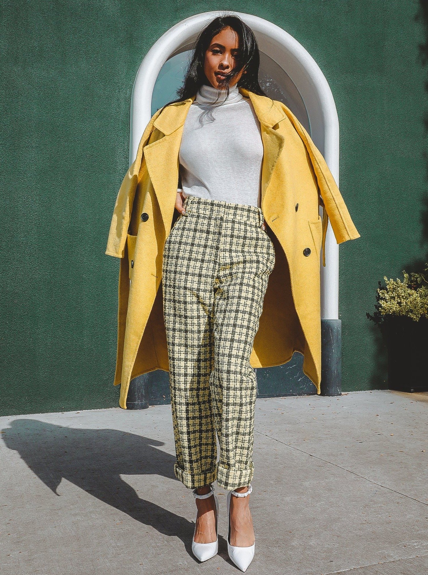 Serena Double Breasted Trench Coat in cozy wool with contrasting buttons and a tie waist, showcasing a sleek silhouette.