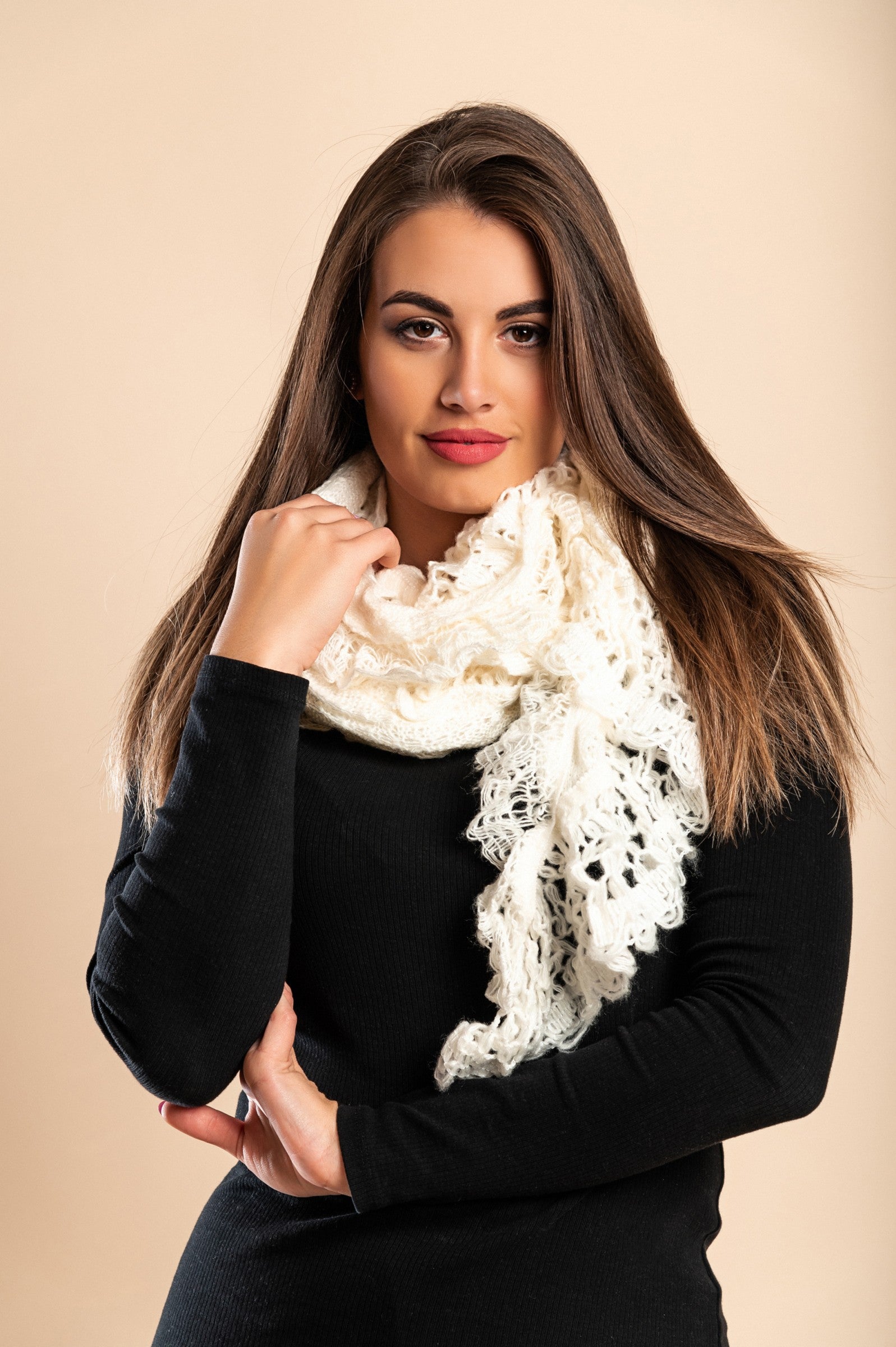 Set of 2 knitted scarves in white and black, showcasing their soft texture and stylish design.