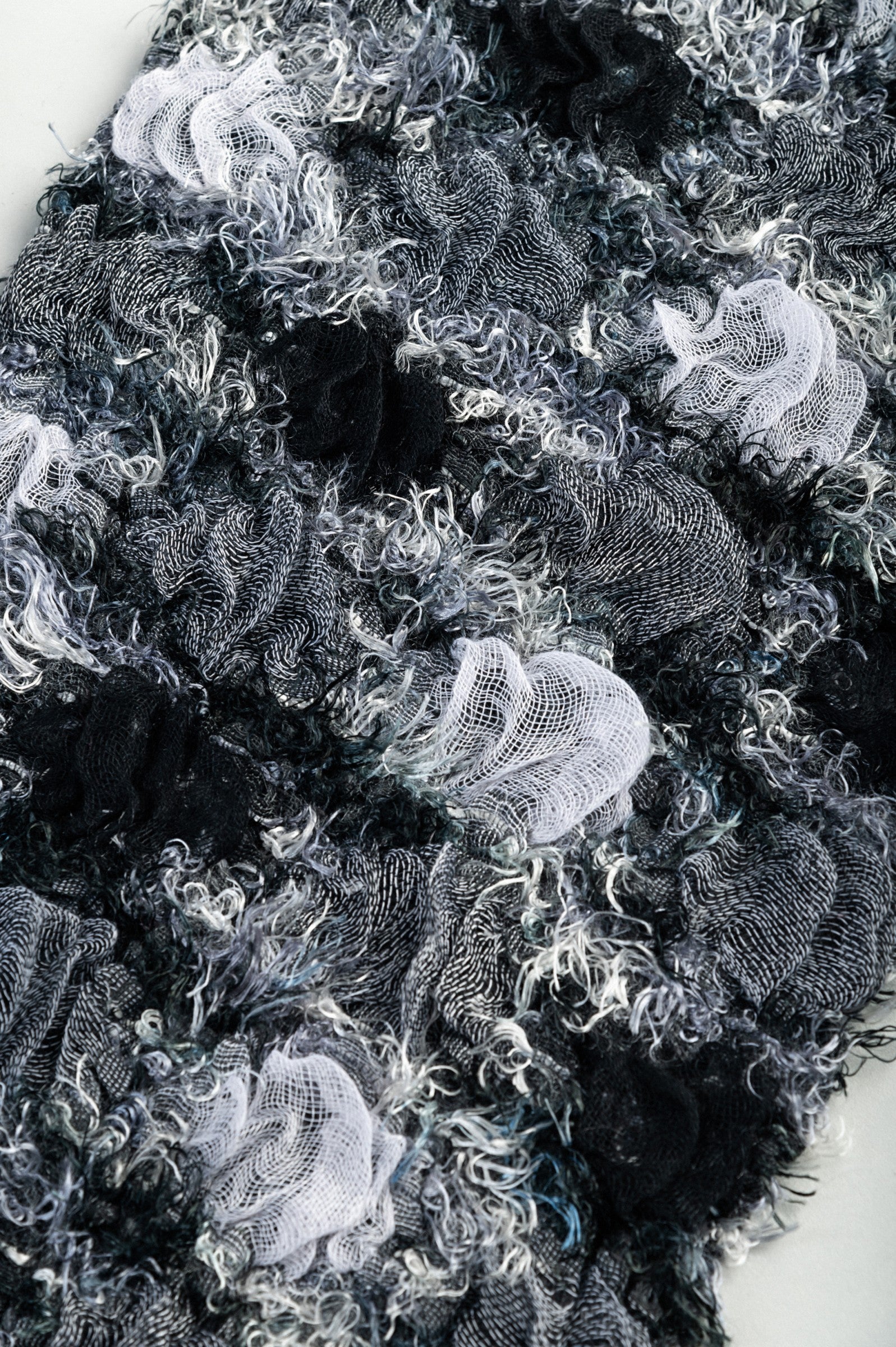 Set of 3 elegant scarves in black, blue, and brown, made from 100% viscose, showcasing their soft texture and vibrant colors.