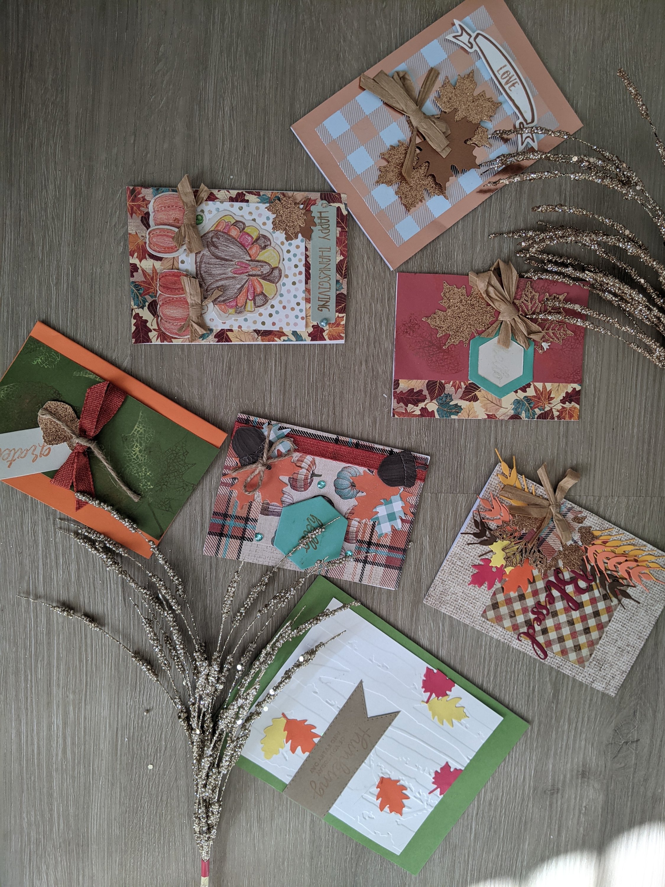 A set of 7 handmade fall cards featuring unique autumn designs, each with a matching envelope, perfect for personal messages.