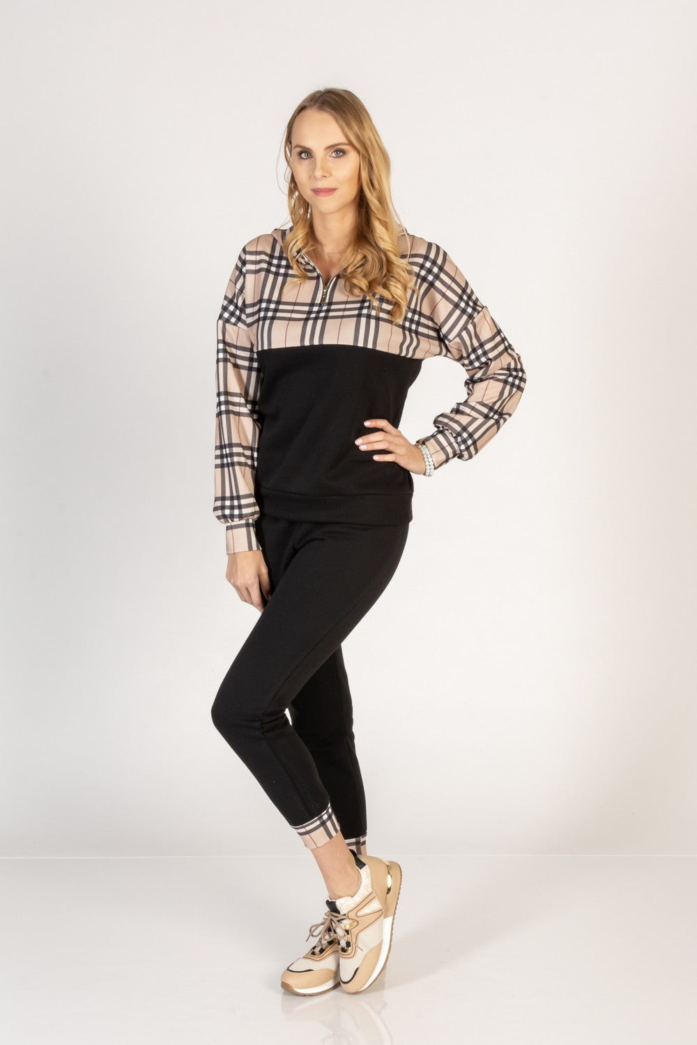 Black cotton tracksuit set featuring a checkered print T-shirt with long sleeves and zippered collar, paired with elastic waist pants with side pockets.