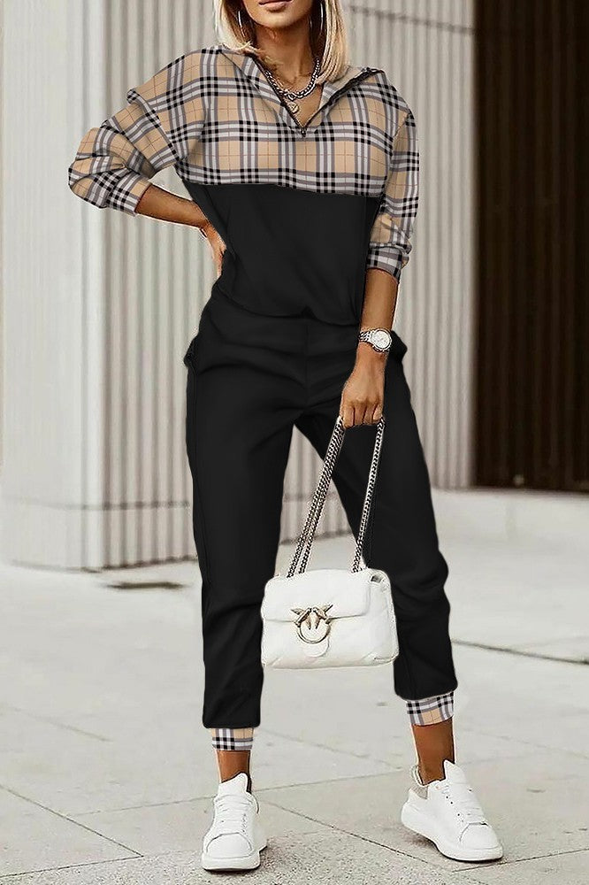 Set of black cotton tracksuit featuring a checkered print T-shirt with long sleeves and zippered collar, paired with elastic waist pants.