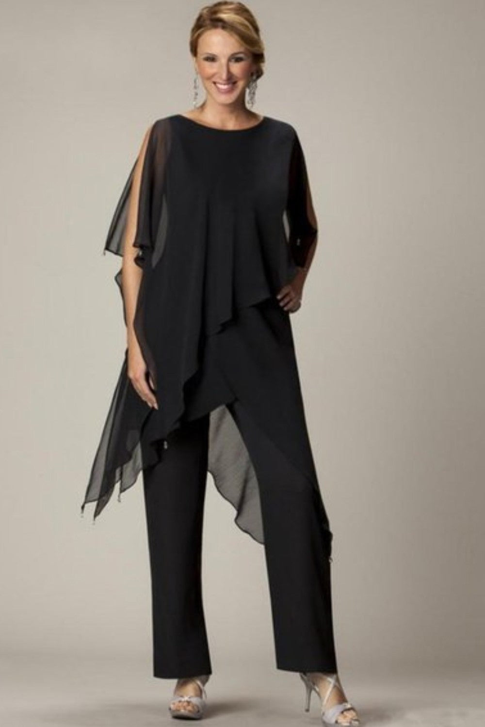 Elegant Claudette set featuring a translucent tunic and long pants in black, showcasing a loose fit and round collar.