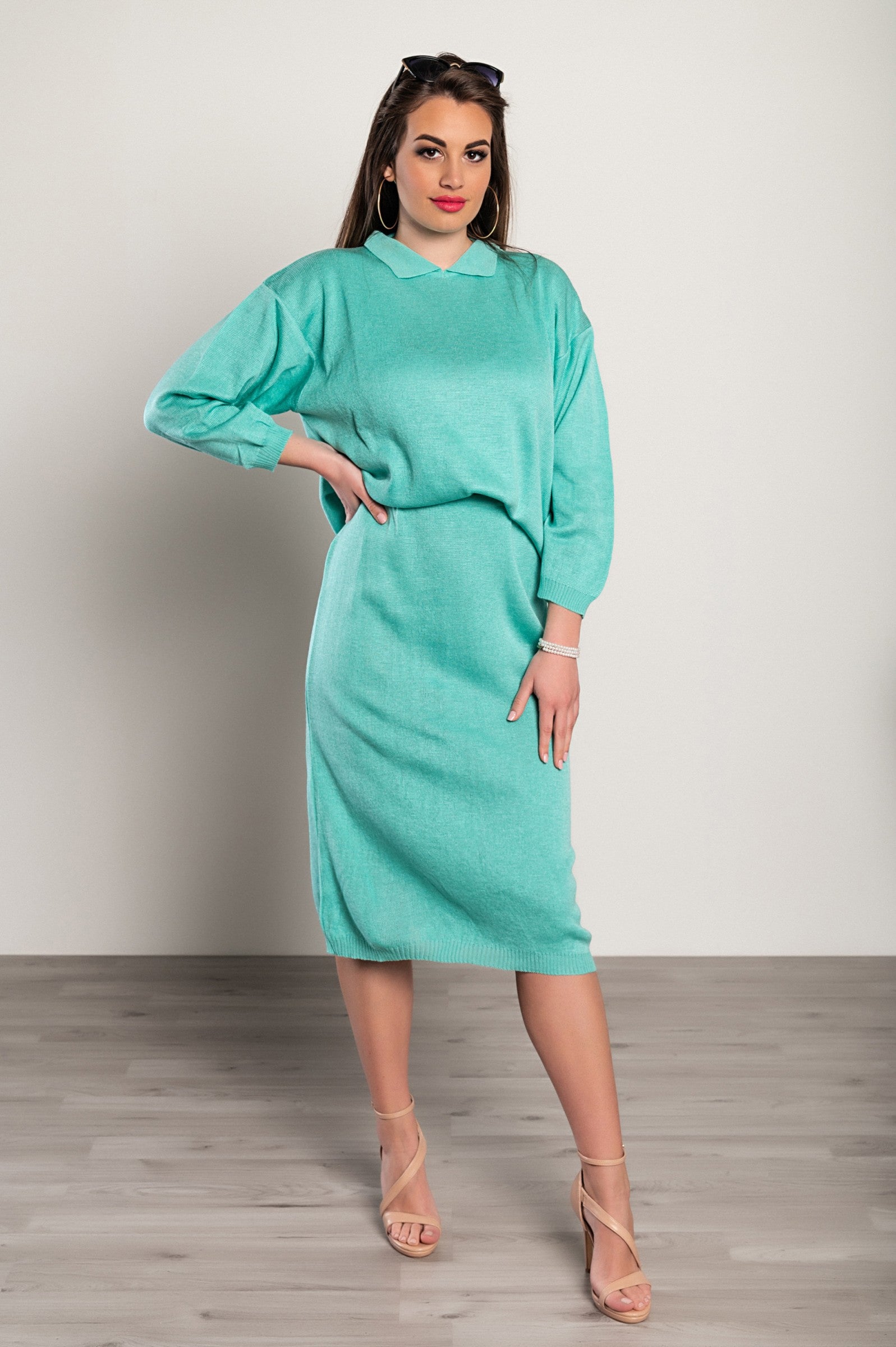 Turquoise skirt and long knit top set, featuring a loose-fit design and elasticated waist, made from high-quality lightweight fabric.
