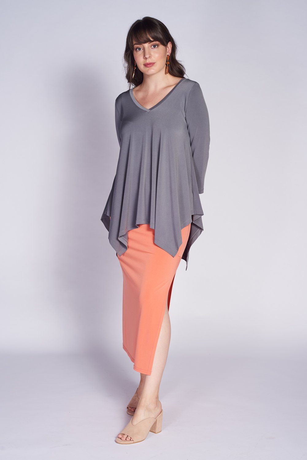 Seville Blouse in Grey featuring a V-neck and 3/4 sleeves, made from soft stretch knit jersey.