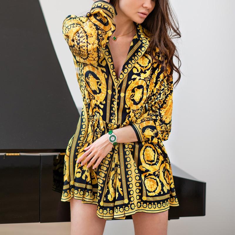 A stylish women's gold dress featuring a sexy paisley vintage print, v-neckline, and full sleeves, perfect for autumn outings.