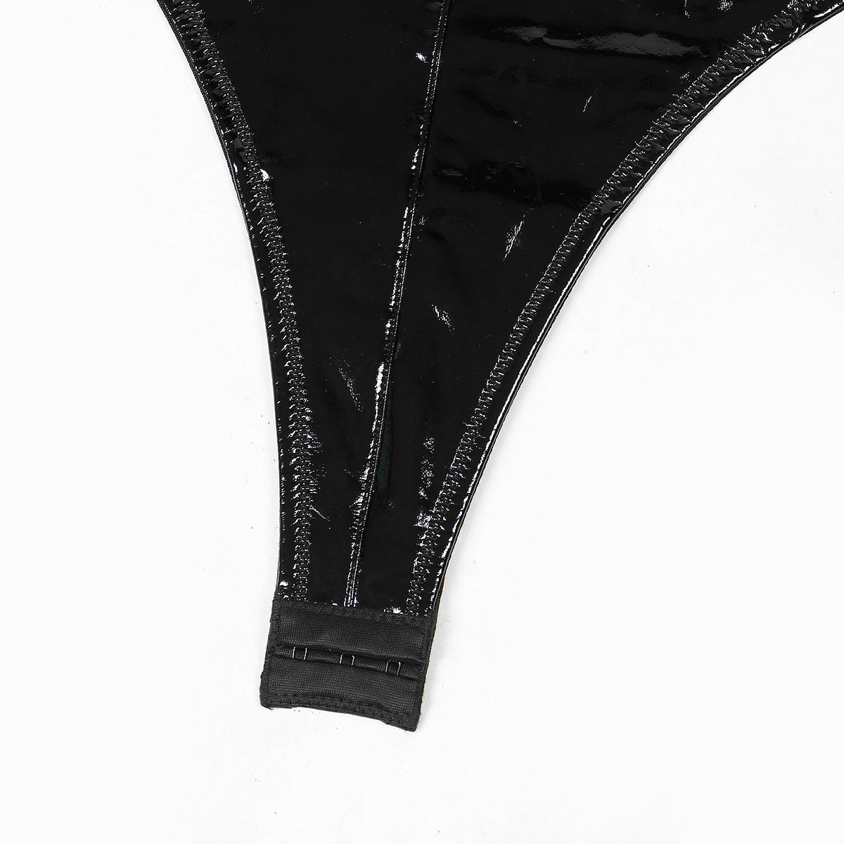 A seductive patent leather uniform featuring metal chains, backless design, and lace-up details, perfect for intimate occasions.