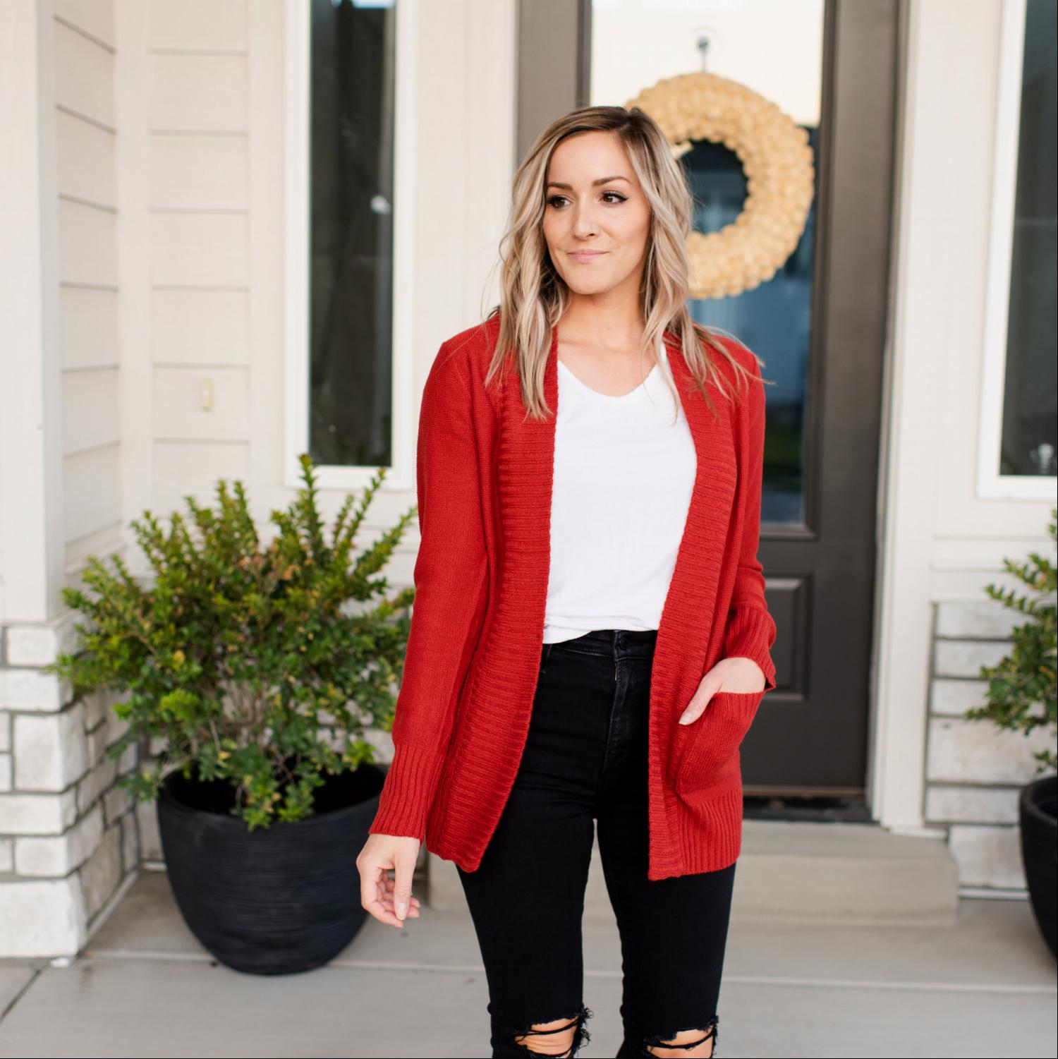 A stylish Shawl Collar Patch Pocket Long Sleeve Open Cardigan in vibrant red, featuring large side pockets and ribbed cuffs.
