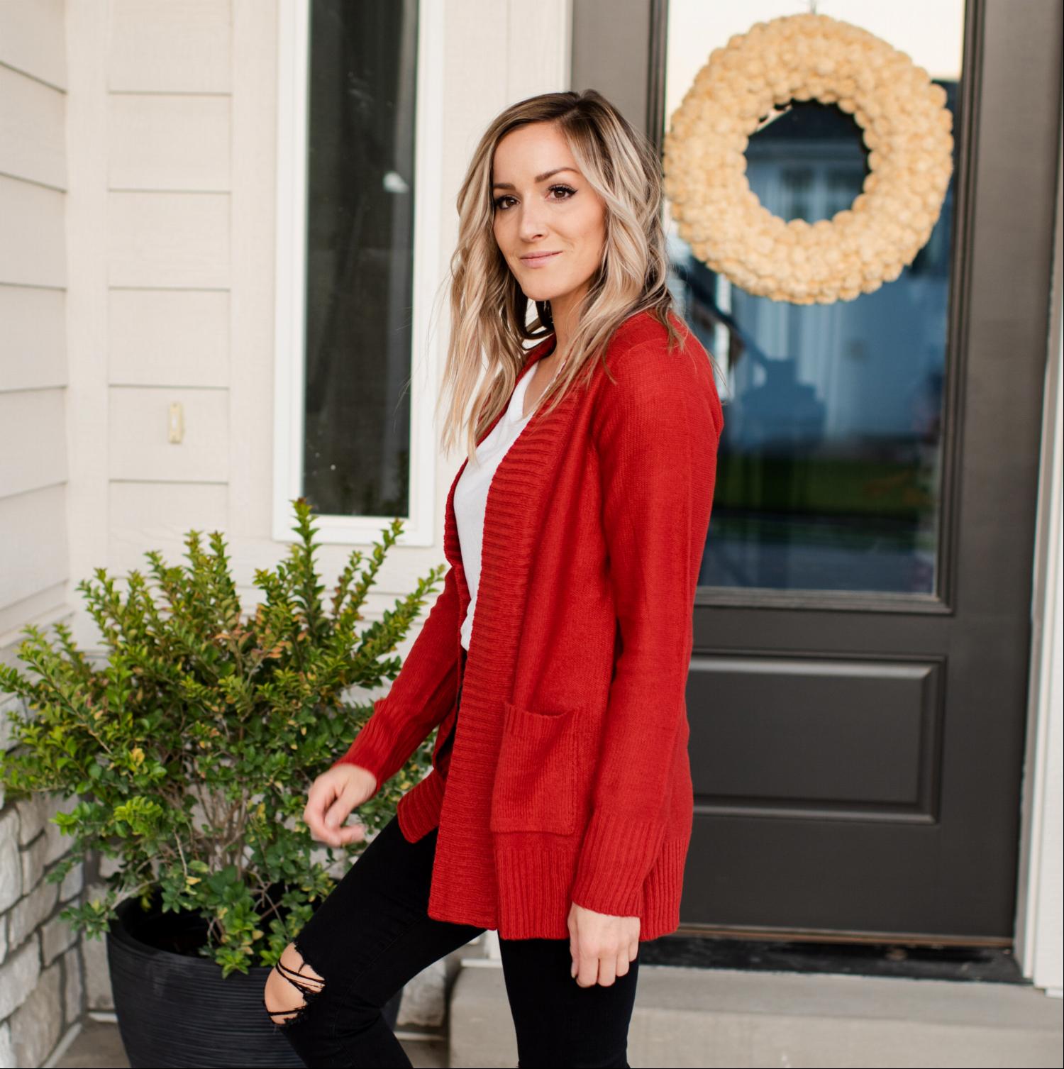 A stylish Shawl Collar Patch Pocket Long Sleeve Open Cardigan in vibrant red, featuring large side pockets and ribbed cuffs.