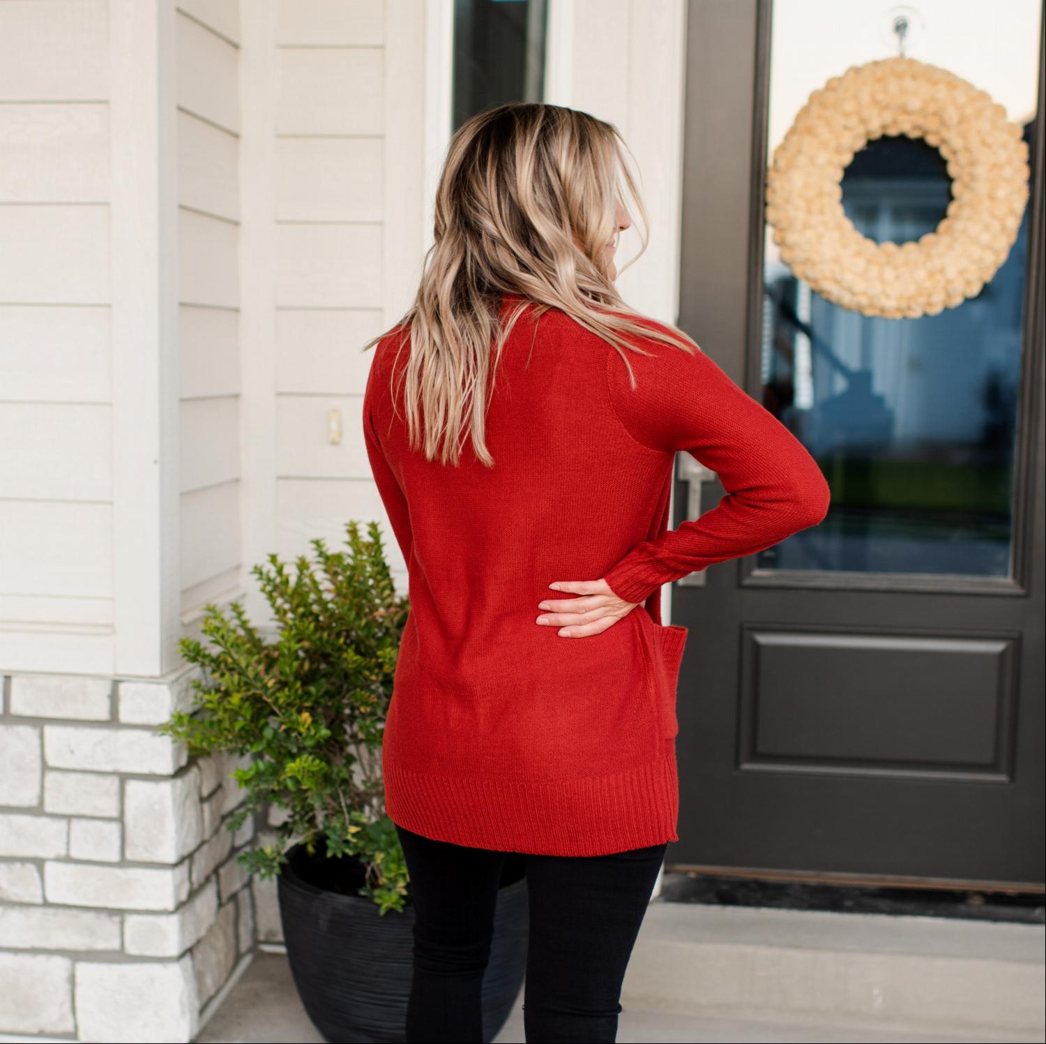 A stylish Shawl Collar Patch Pocket Long Sleeve Open Cardigan in vibrant red, featuring large side pockets and ribbed cuffs.