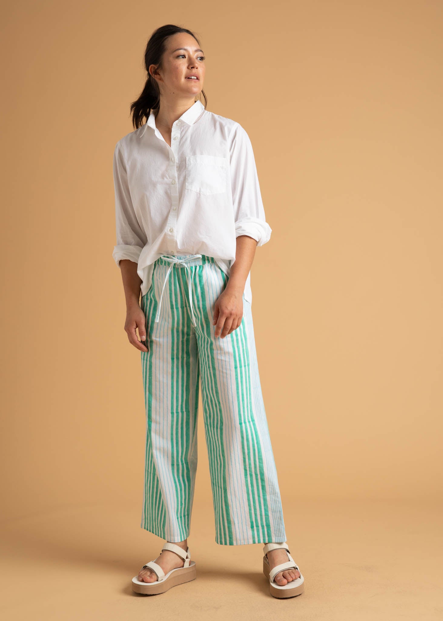 Shore Pant in Mixed Up Stripe featuring Seaglass and Cerulean colors, showcasing its relaxed fit and modern cropped length.