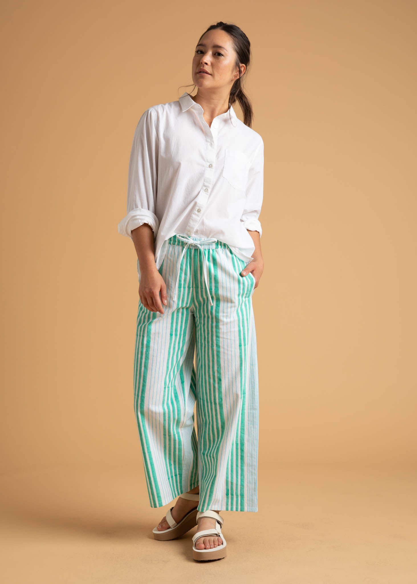 Shore Pant in Mixed Up Stripe featuring Seaglass and Cerulean colors, showcasing its relaxed fit and modern cropped length.