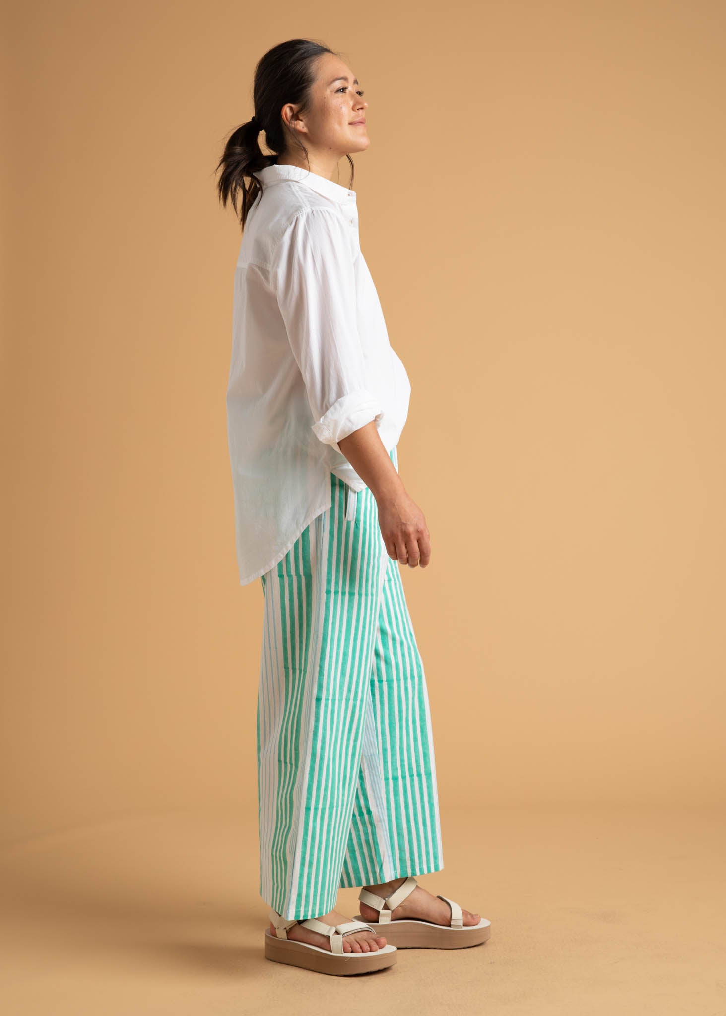 Shore Pant in Mixed Up Stripe featuring Seaglass and Cerulean colors, showcasing its relaxed fit and modern cropped length.