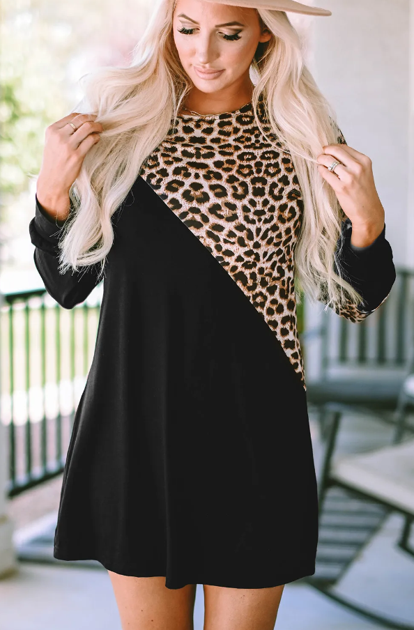 A stylish black mini dress featuring a trendy leopard print design, round neckline, and long sleeves, perfect for various occasions.