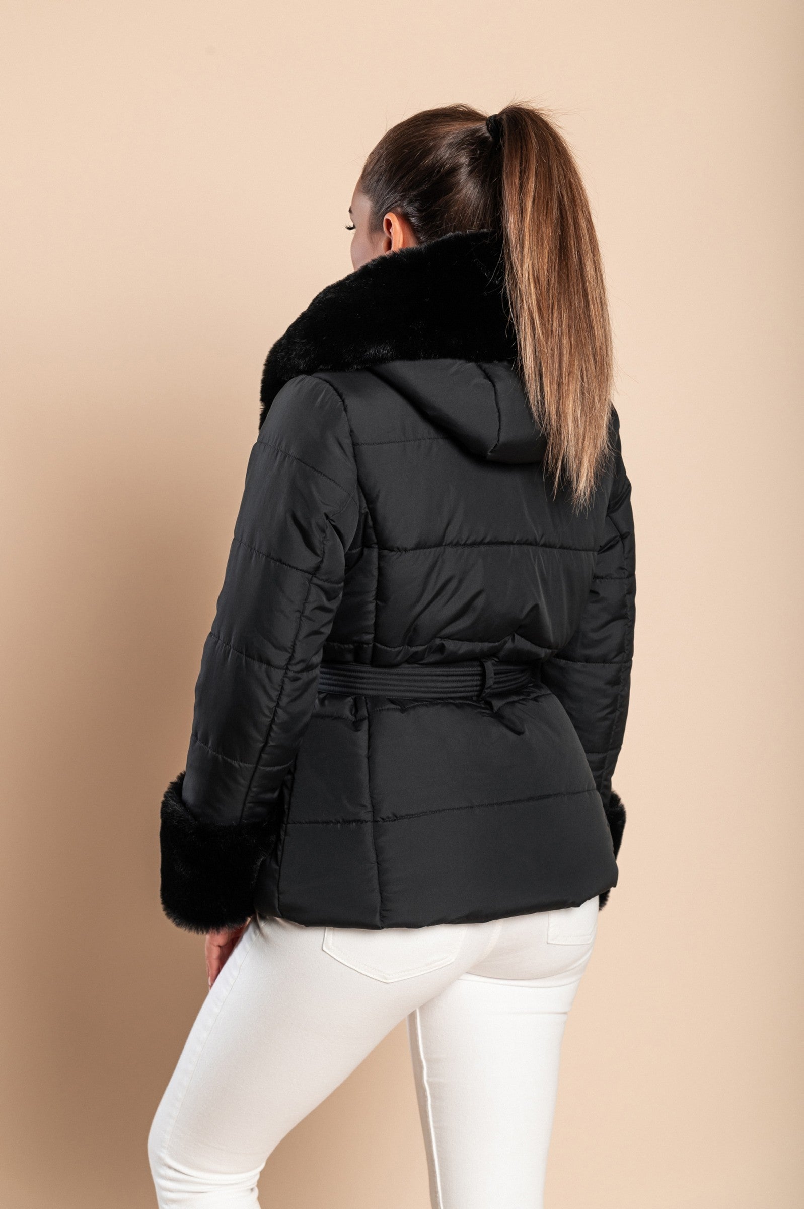 Black short padded jacket with faux fur trim, featuring a quilted design, side pockets, and a stylish belt.