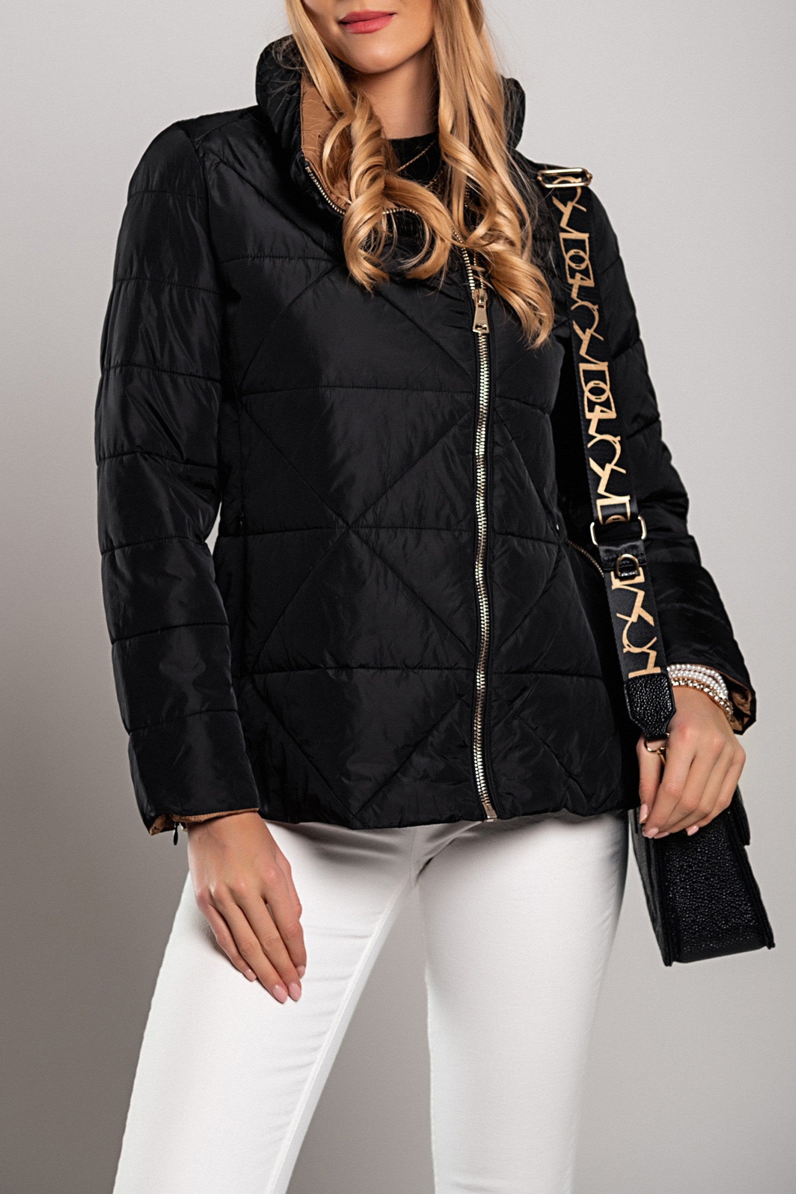 Short black padded jacket with high collar and concealed zip pockets, showcasing a stylish design and warm padding.