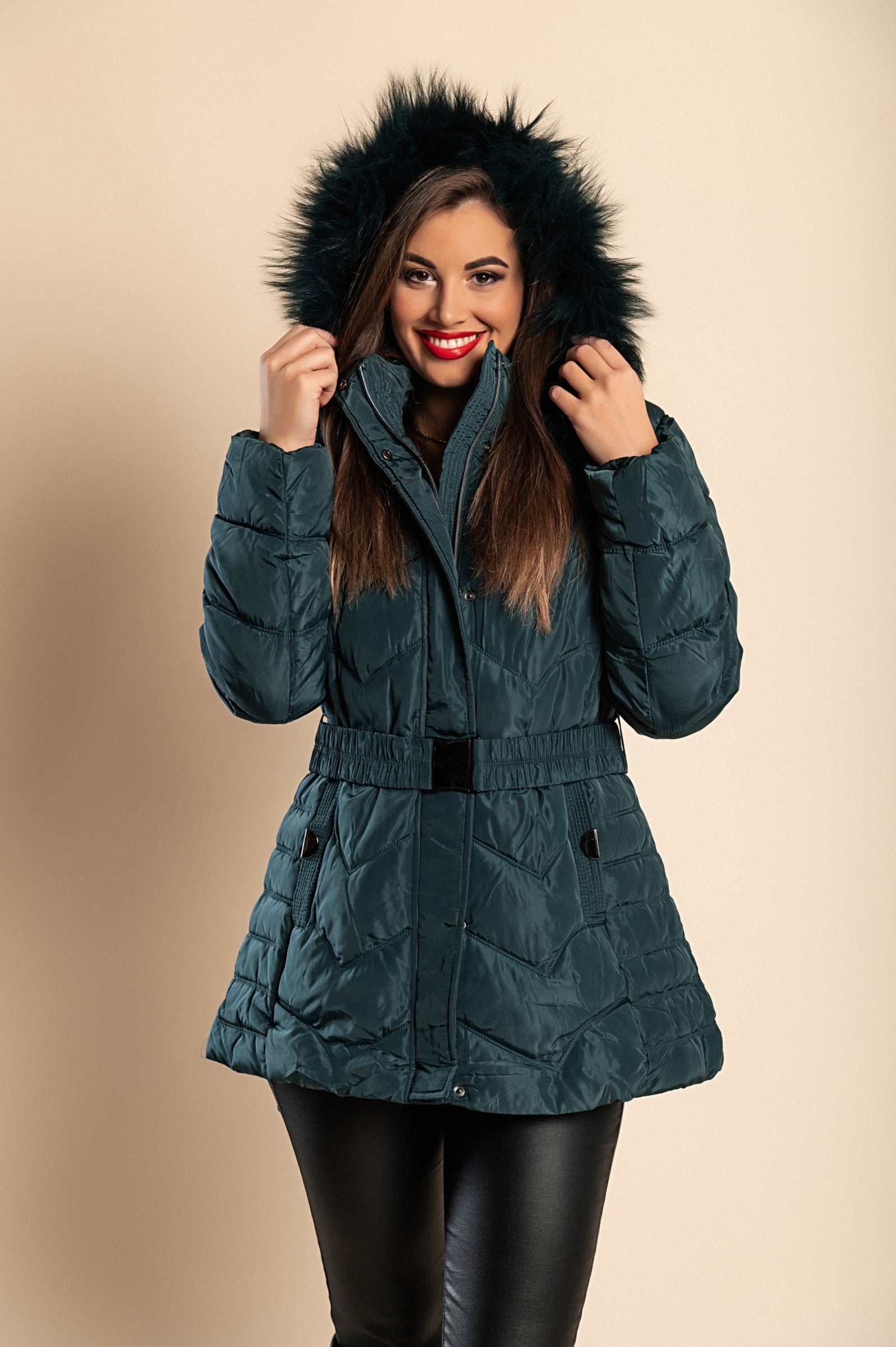 Plus size short padded winter jacket with hood in petrol color, featuring synthetic fur lining and zip closure.