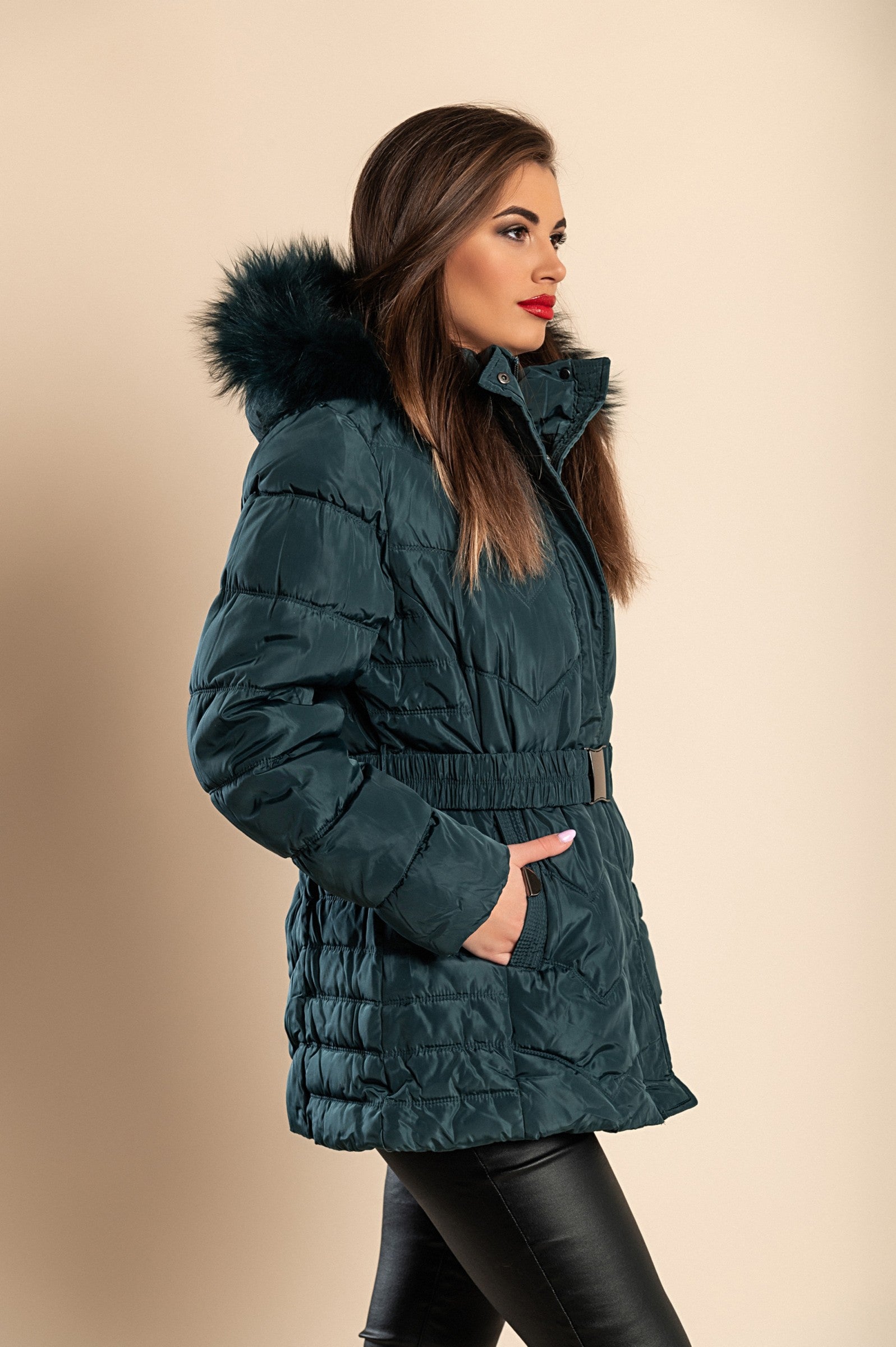 Plus size short padded winter jacket with hood in petrol color, featuring synthetic fur lining and zip closure.