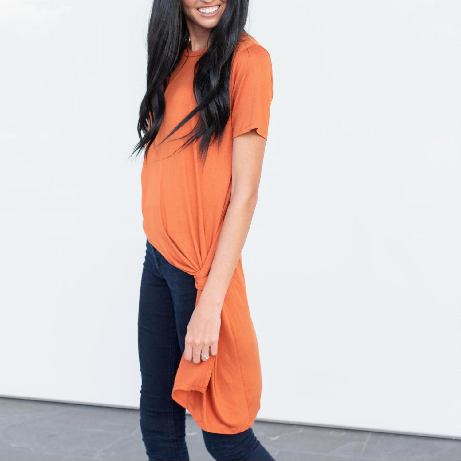 A stylish Short Sleeve High Low Front Tie Tunic Top in a soft fabric, featuring a flattering high low hemline and a front tie detail.