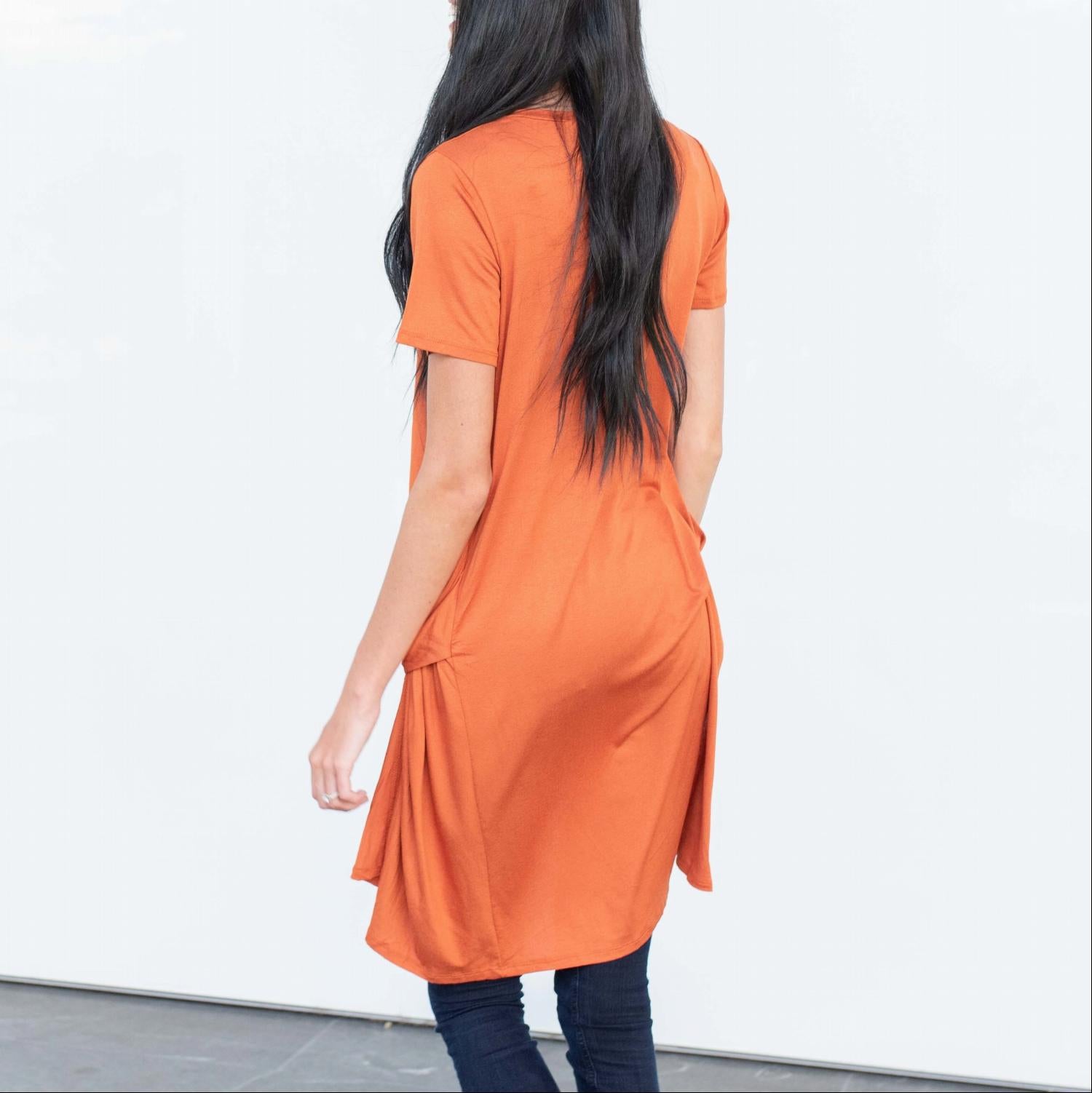 A stylish Short Sleeve High Low Front Tie Tunic Top in a soft fabric, featuring a flattering high low hemline and a front tie detail.