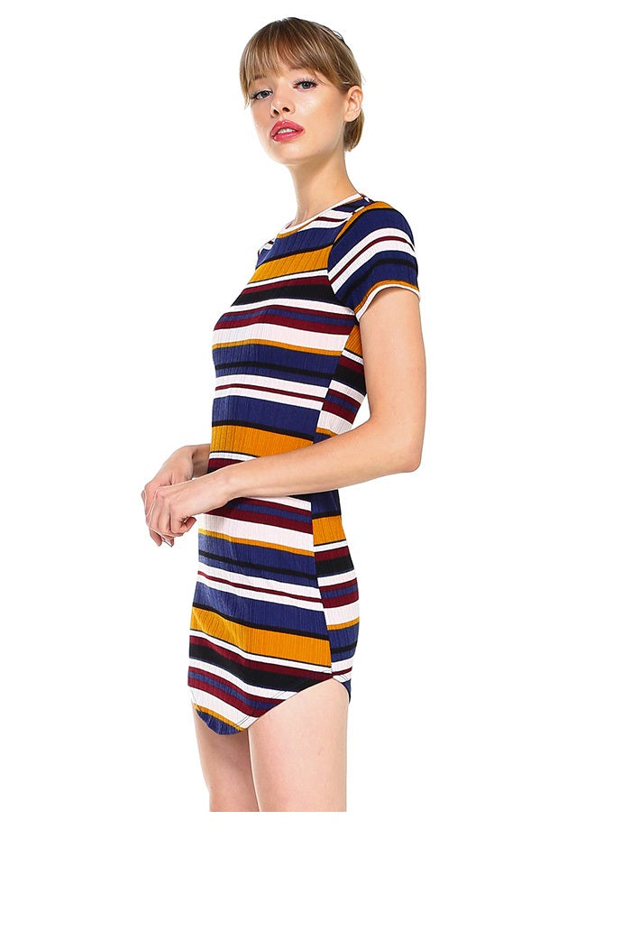 A model wearing a stylish short sleeve ribbed striped mini dress, showcasing its body contour fit and vibrant multi-stripe design.