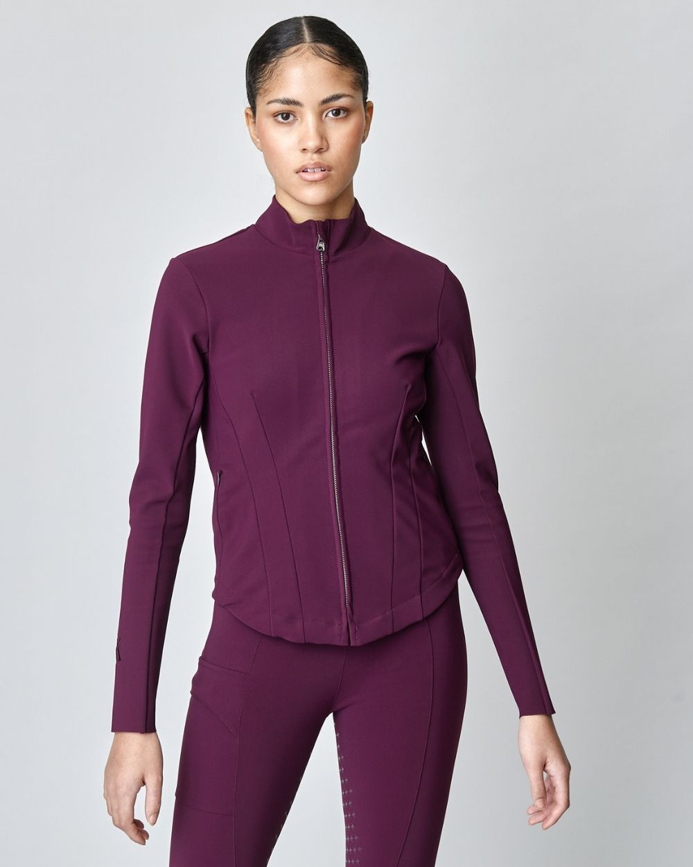 Burgundy Signature Riding Jacket made from Italian jersey fiber, featuring a fitted silhouette and concealed pockets.