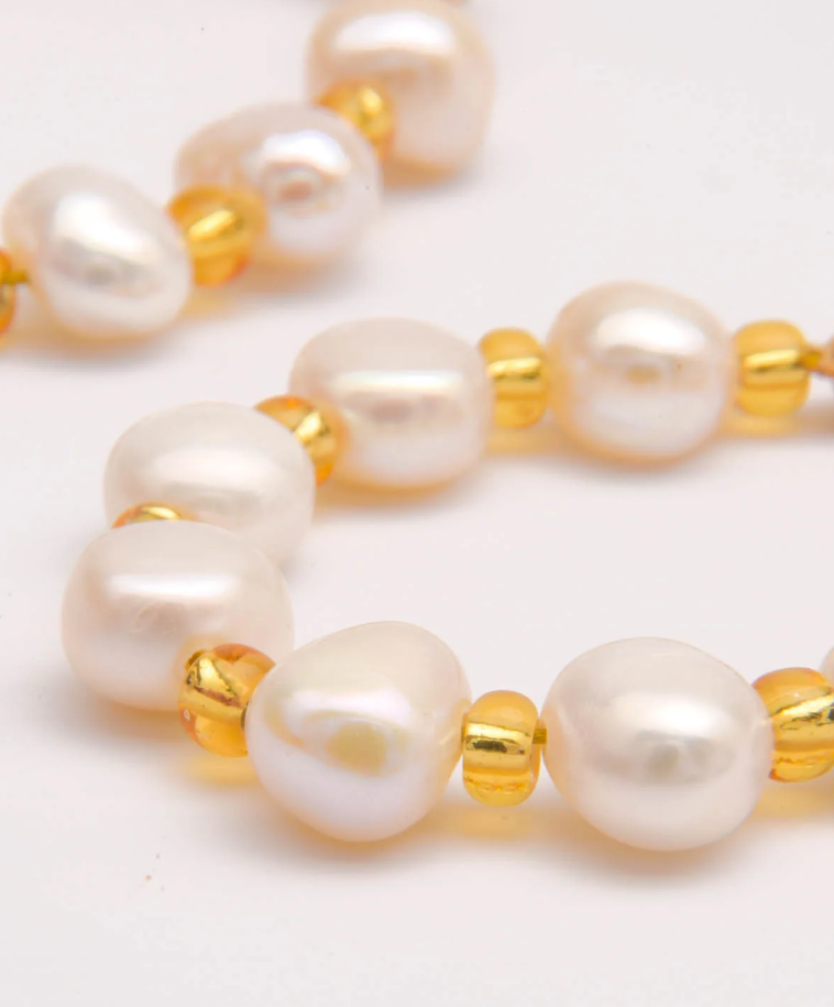 Elegant silver earrings featuring imitation pearls with a luxurious gold color finish, perfect for any occasion.