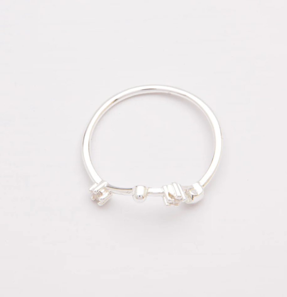 A beautiful silver ring adorned with decorative diamonds, showcasing its elegant design and high-quality craftsmanship.