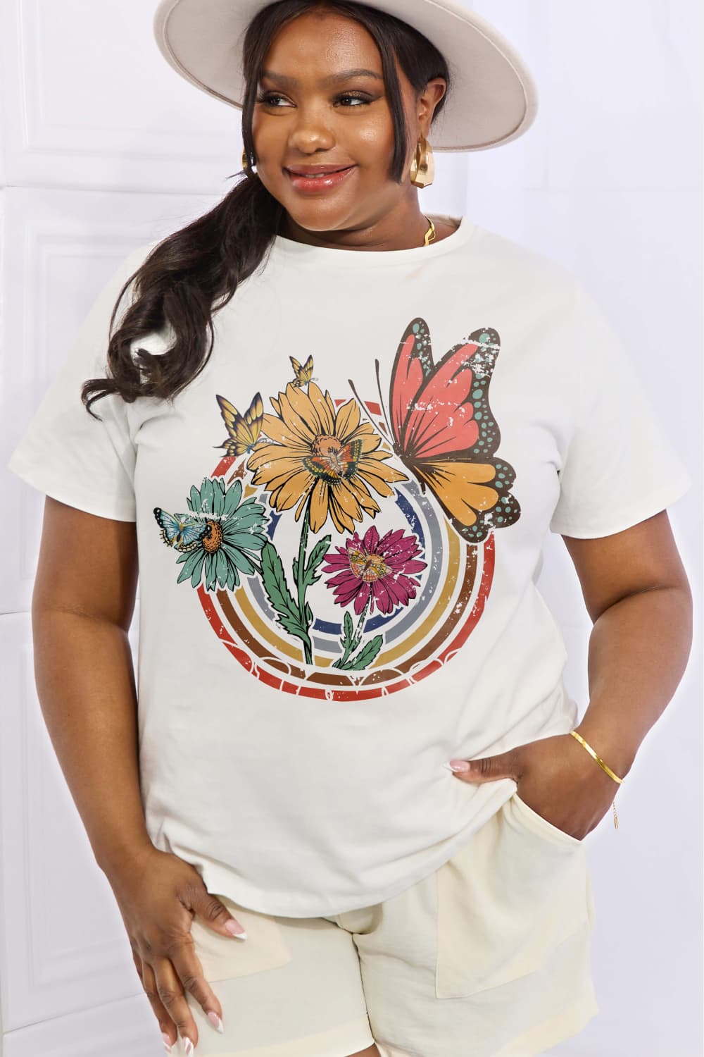 Simply Love Full Size Flower & Butterfly Graphic Cotton Tee featuring a vibrant floral and butterfly design on a casual round neck tee.