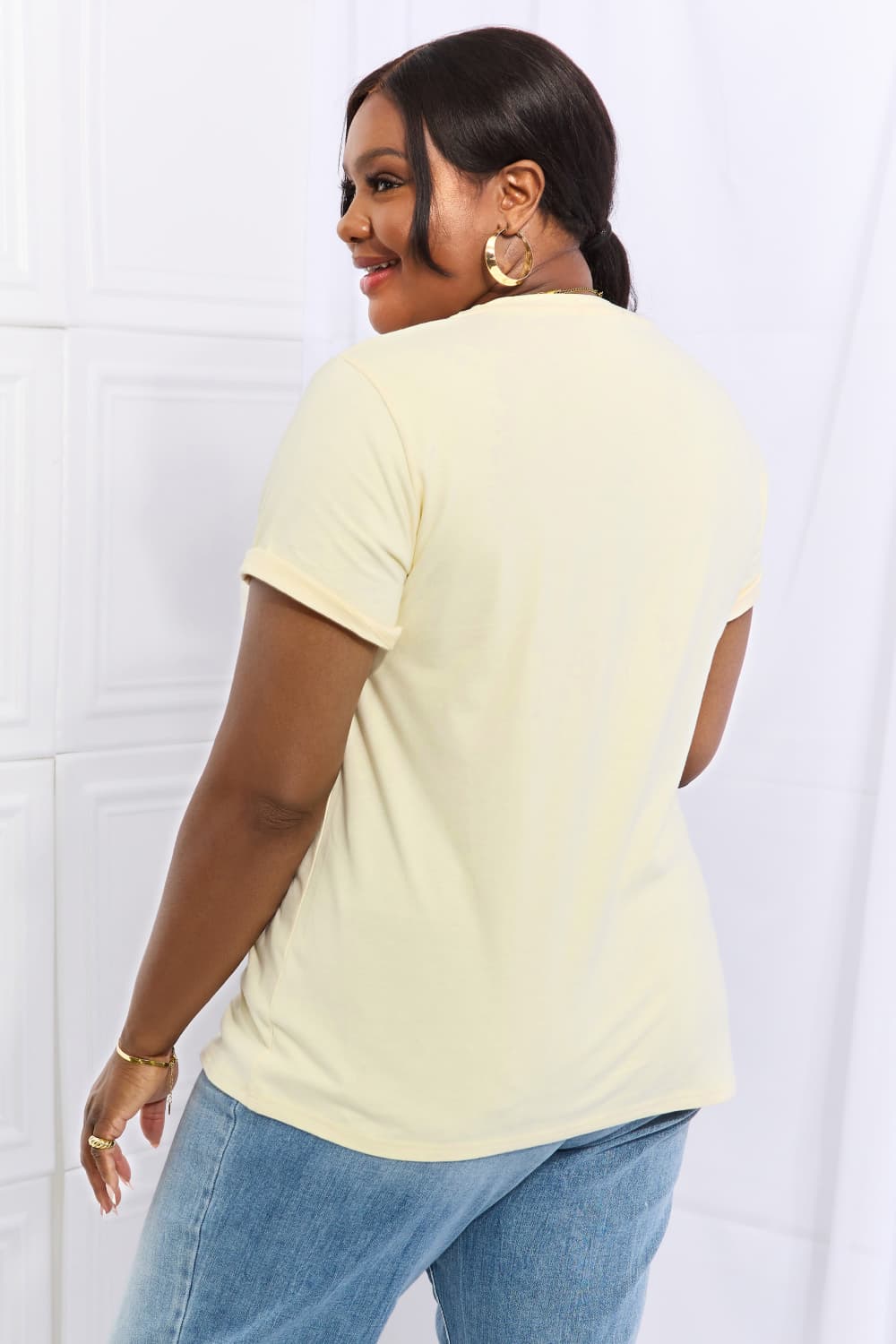 Simply Love Full Size Flower & Butterfly Graphic Cotton Tee featuring a vibrant floral and butterfly design on a casual round neck tee.