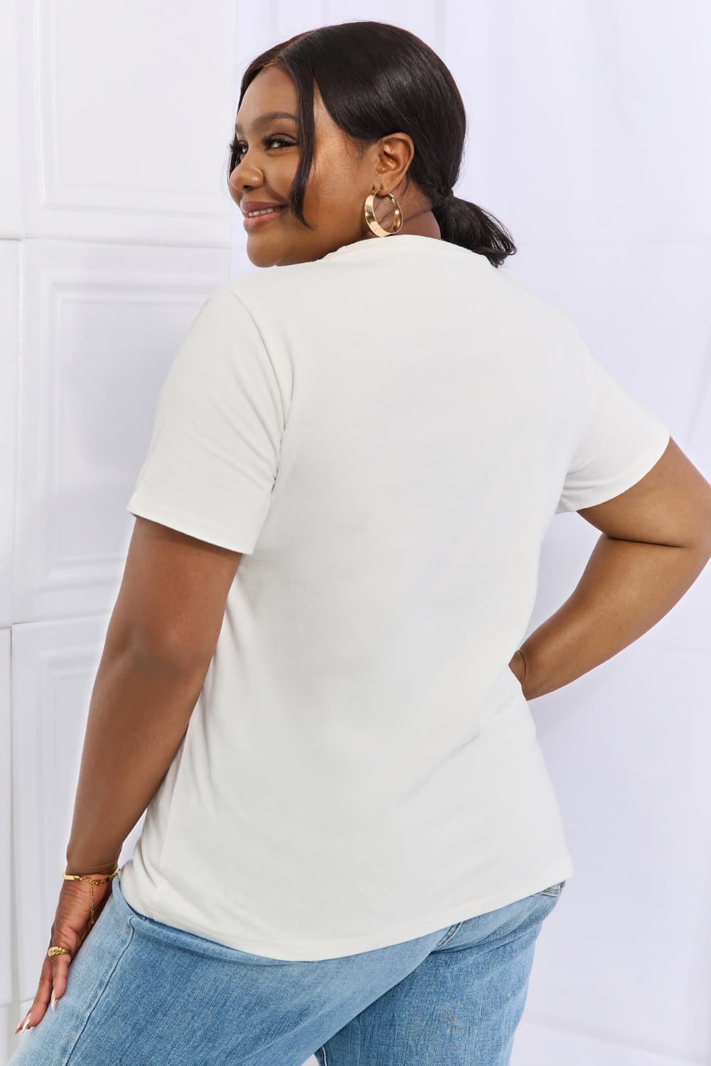 Simply Love Full Size Flower & Butterfly Graphic Cotton Tee featuring a vibrant floral and butterfly design on a casual round neck tee.