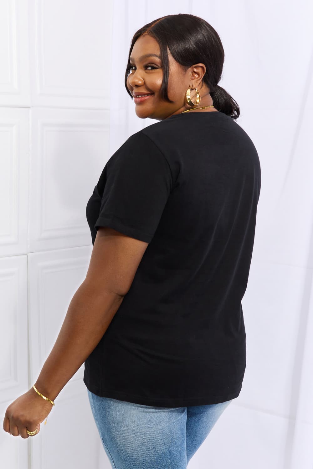 Simply Love Full Size Flower & Butterfly Graphic Cotton Tee featuring a vibrant floral and butterfly design on a casual round neck tee.