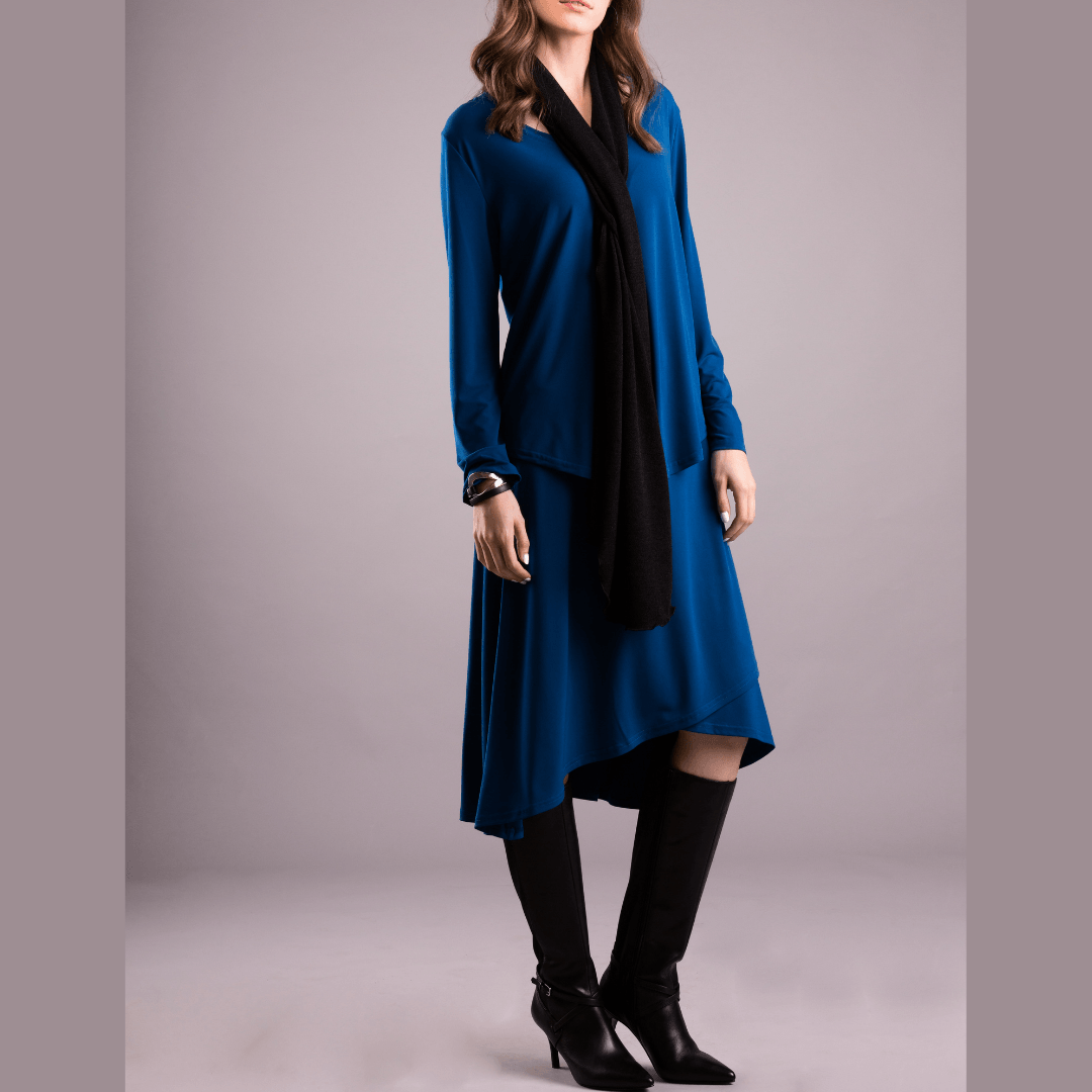 A cozy Mirage Knit Skinny Scarf in various colors, showcasing its soft texture and versatile styling options.