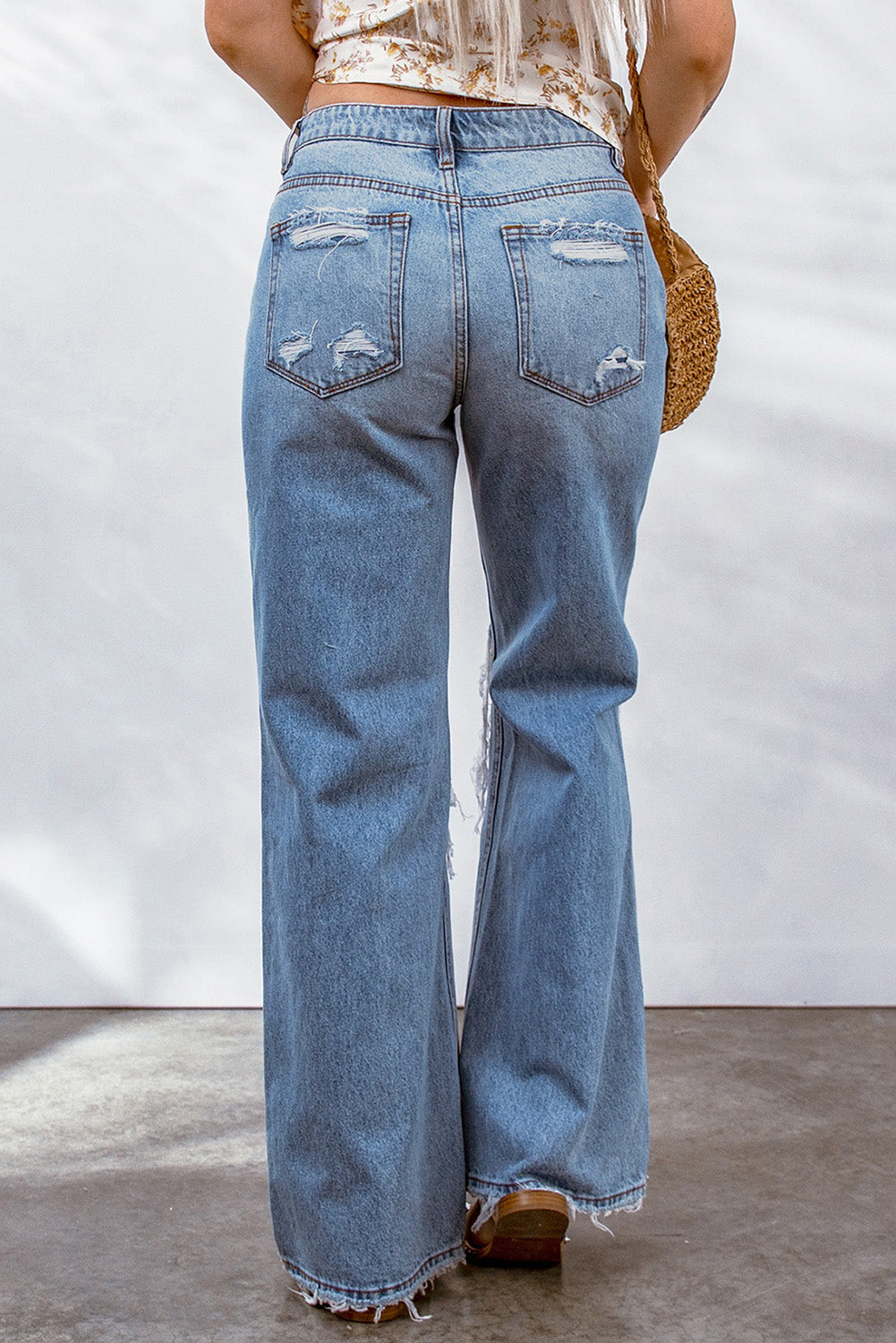 Sky Blue Destroyed Open Knee Wide Leg Jeans featuring a trendy distressed design and wide leg cut, perfect for modern fashion enthusiasts.