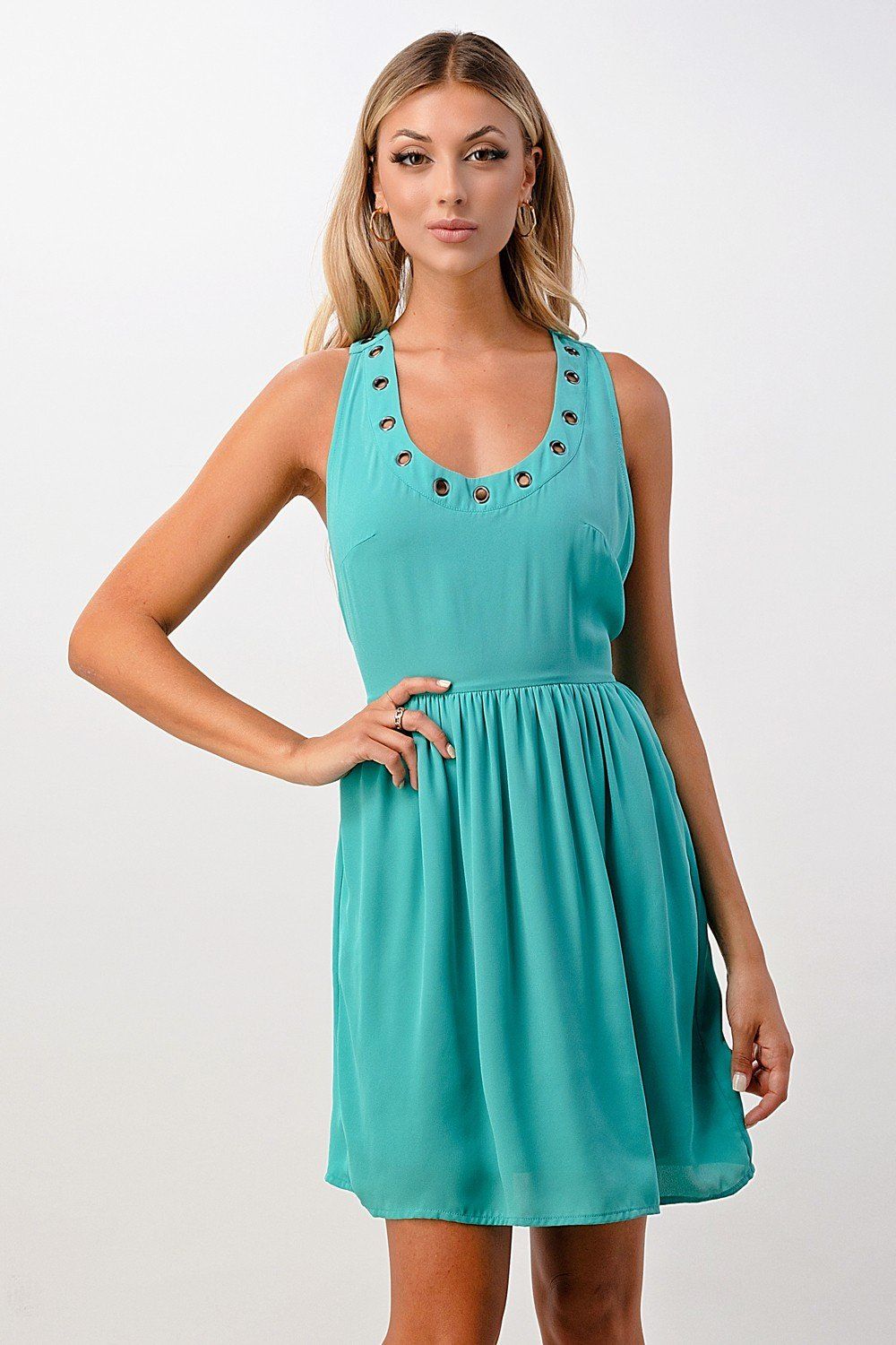 A stylish sleeveless A-line dress featuring grommet details, perfect for various occasions.