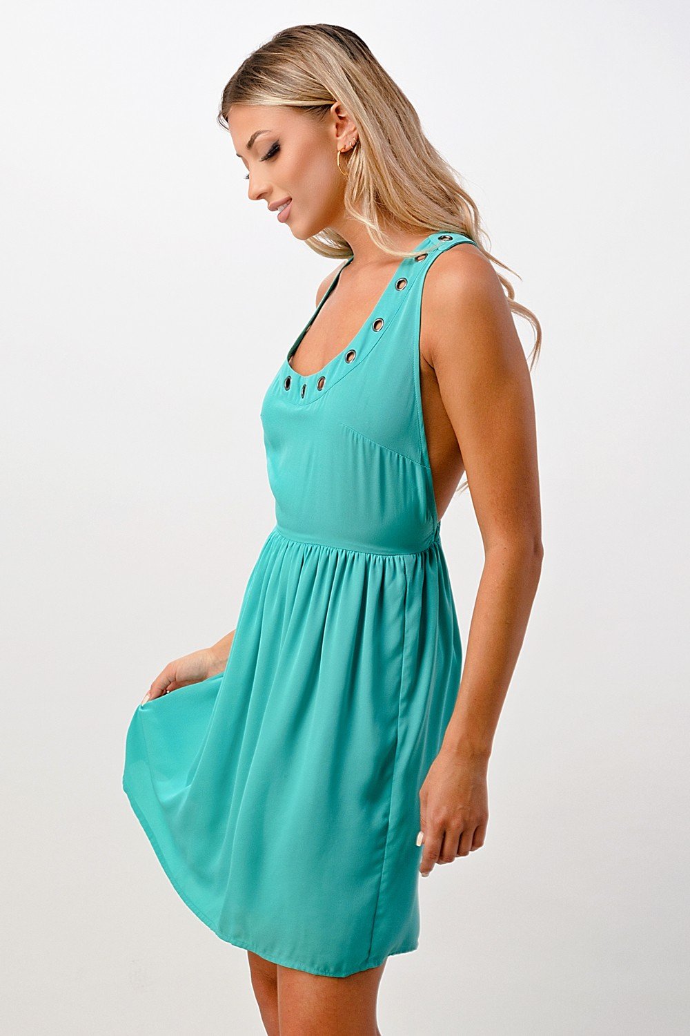 A stylish sleeveless A-line dress featuring grommet details, perfect for various occasions.
