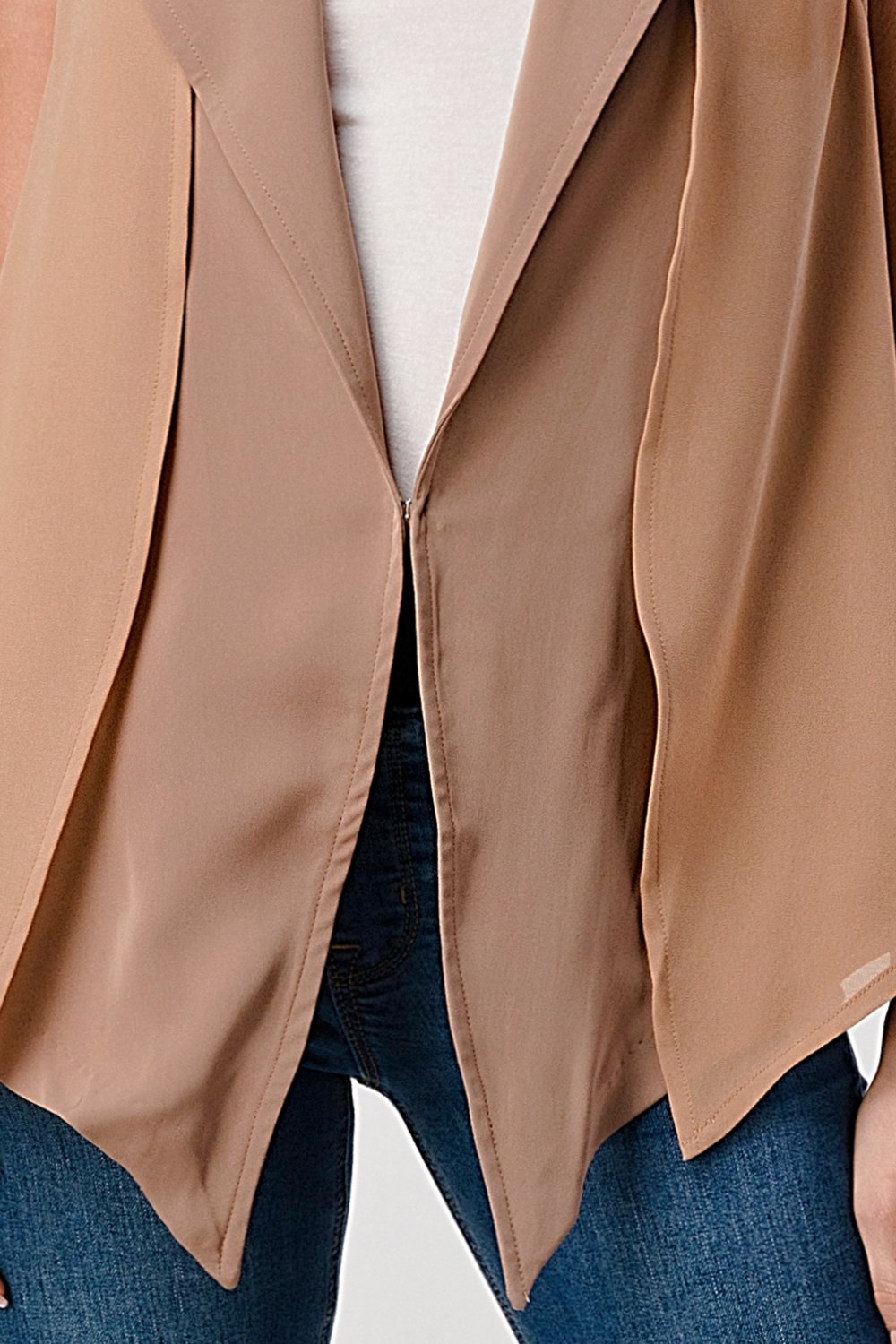 A stylish sleeveless draped open front vest with a high-low hem, perfect for layering over various outfits.