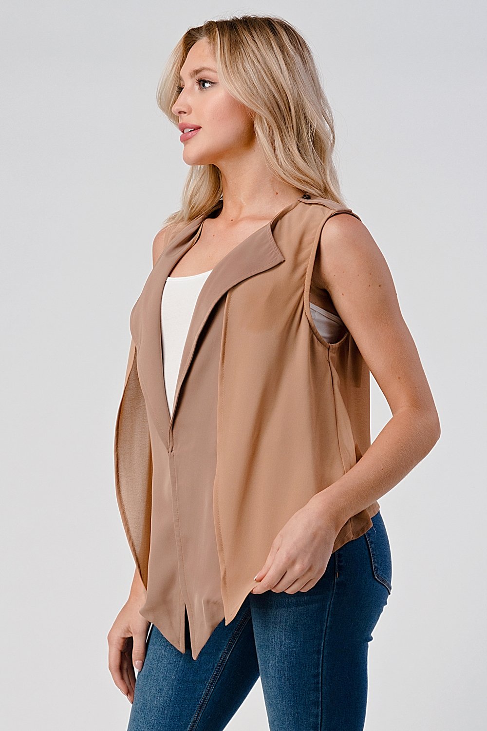 A stylish sleeveless draped open front vest with a high-low hem, perfect for layering over various outfits.