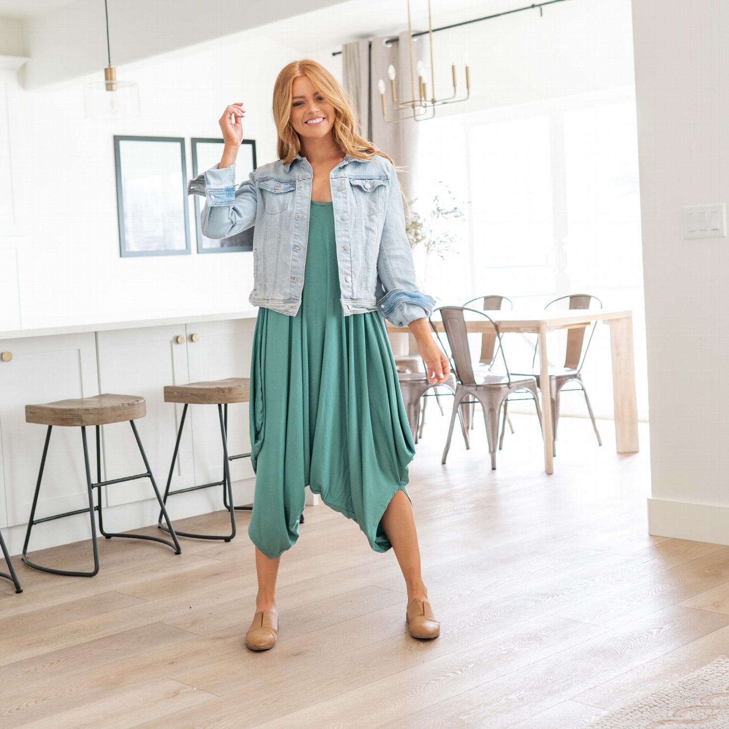 A stylish sleeveless loose fit romper with spaghetti straps, featuring wide legs and a chic design, perfect for summer wear.