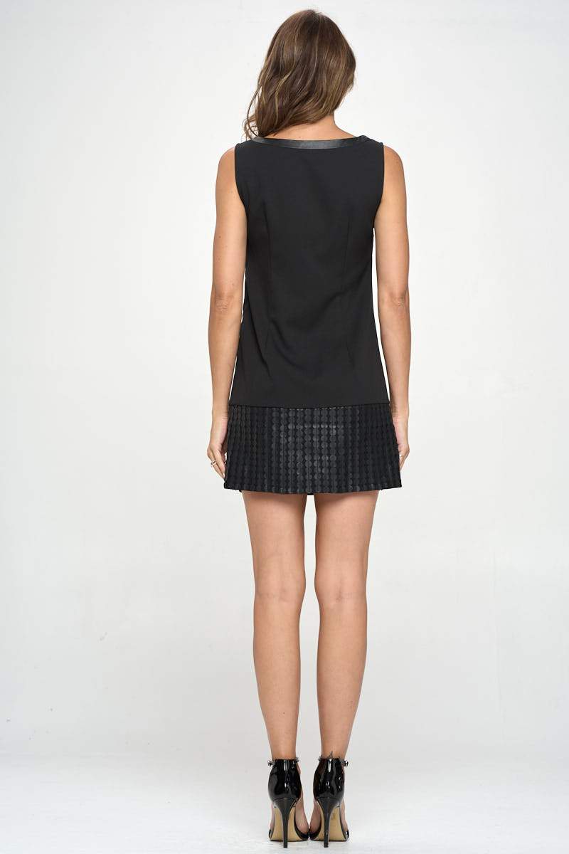 A stylish vegan leather tunic mini dress featuring a unique laser cut design, perfect for modern fashion enthusiasts.