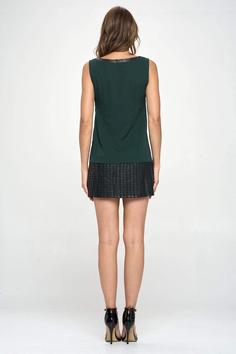 A stylish vegan leather tunic mini dress featuring a unique laser cut design, perfect for modern fashion enthusiasts.