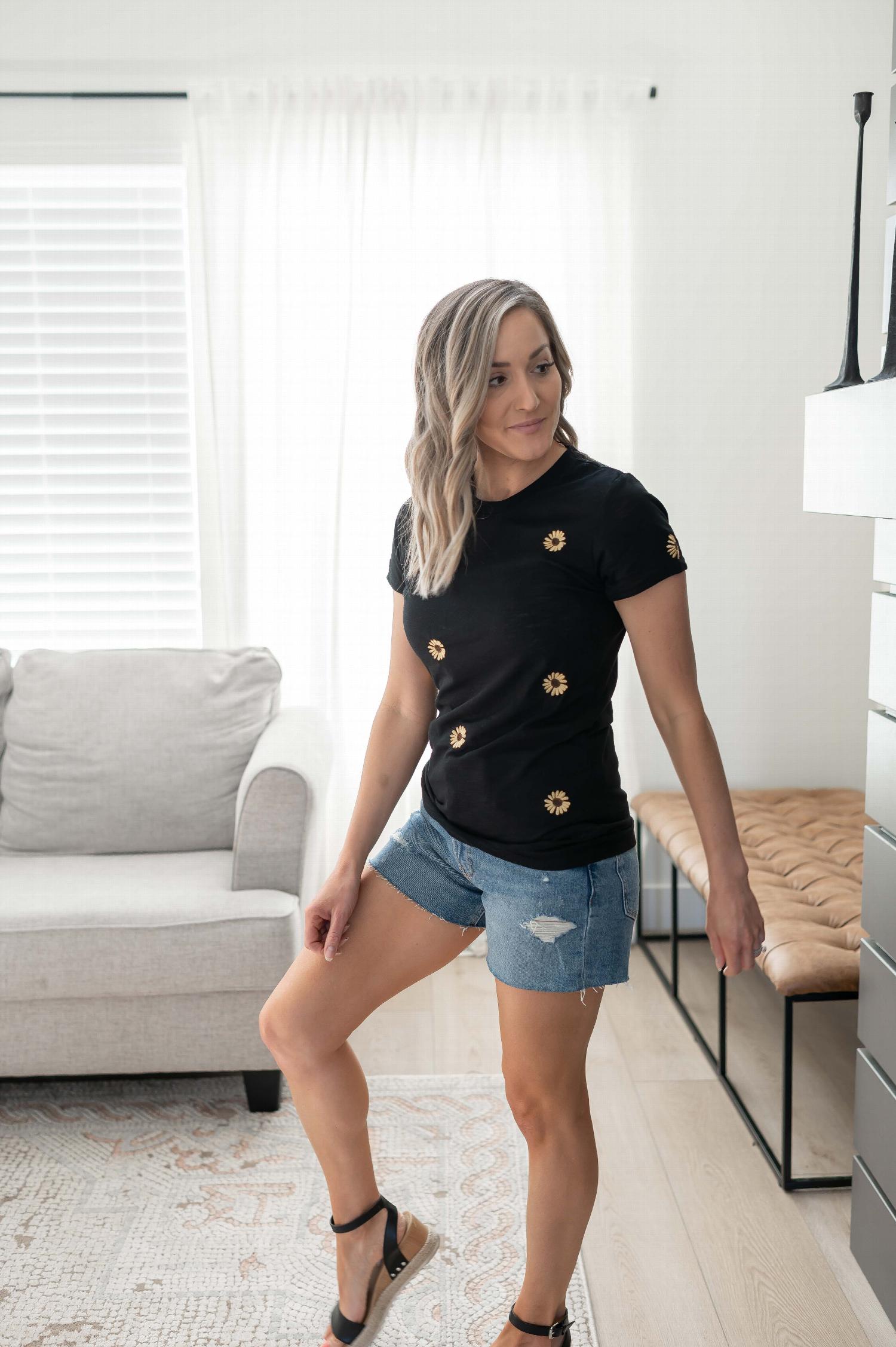 White Slub S Sleeve T Shirt featuring intricate flower embroidery in yellow and brown yarns, showcasing a stylish and comfortable design.