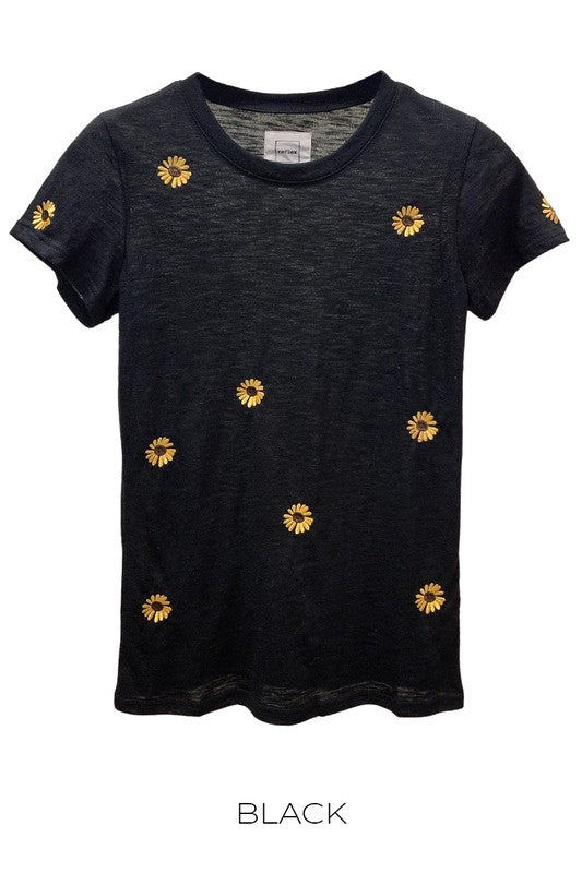 A stylish slub short sleeve t-shirt featuring vibrant sunflower embroidery, showcasing its soft fabric and unique design.